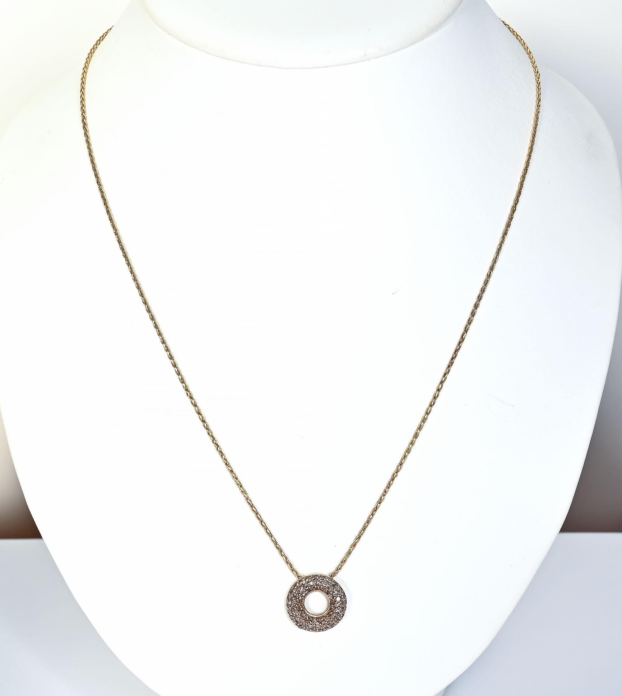 Round pendant necklace with approximately 1 carat of champagne colored diamonds. The pendant is 5/8