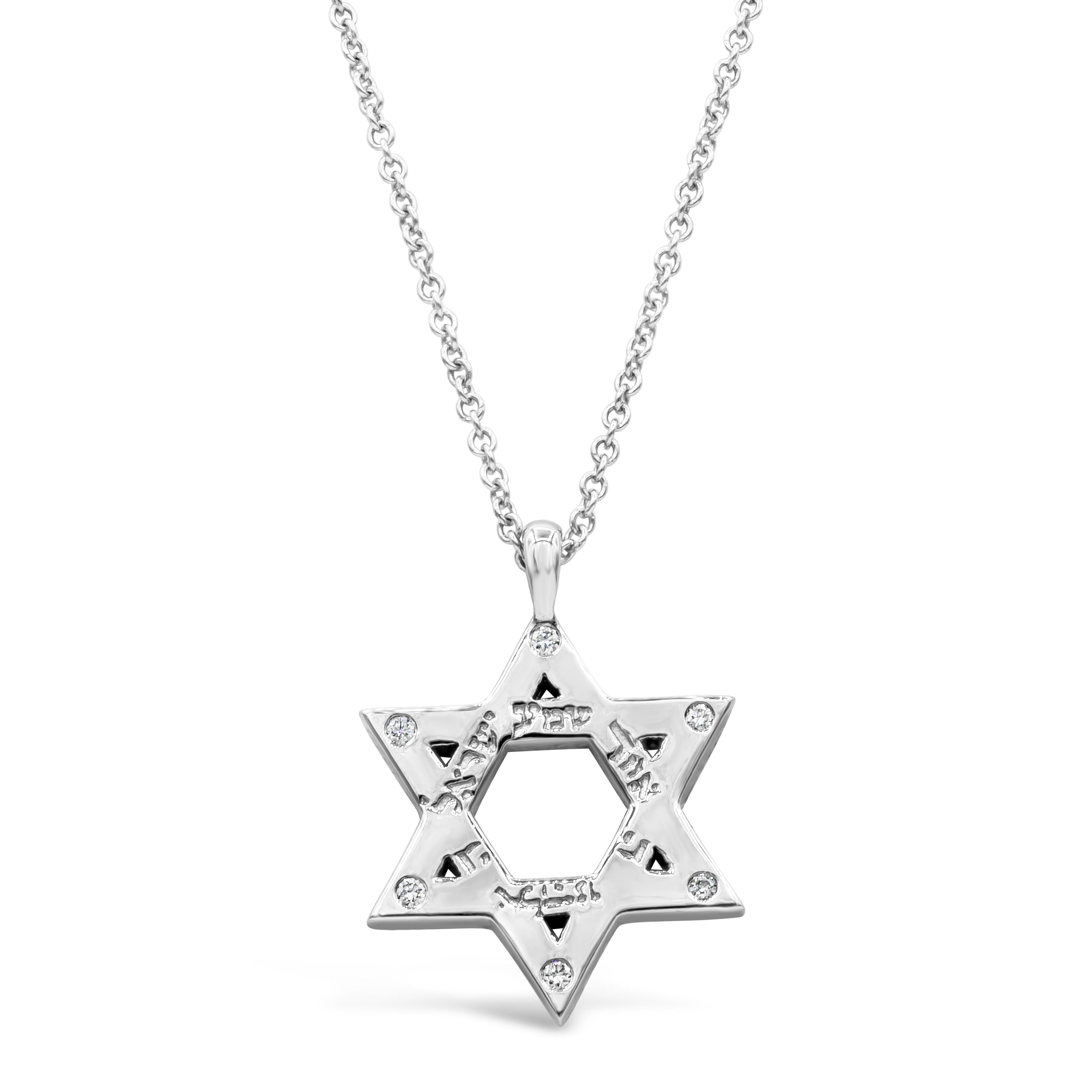 A simple Star of David pendant made in Platinum accented with round diamonds weighing 0.35 carats total. Engraved with a Deuteronomy Verse translated as 