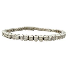 Bracelet de tennis serti de diamants ronds et de diamants de taille princesse en or blanc 14kt