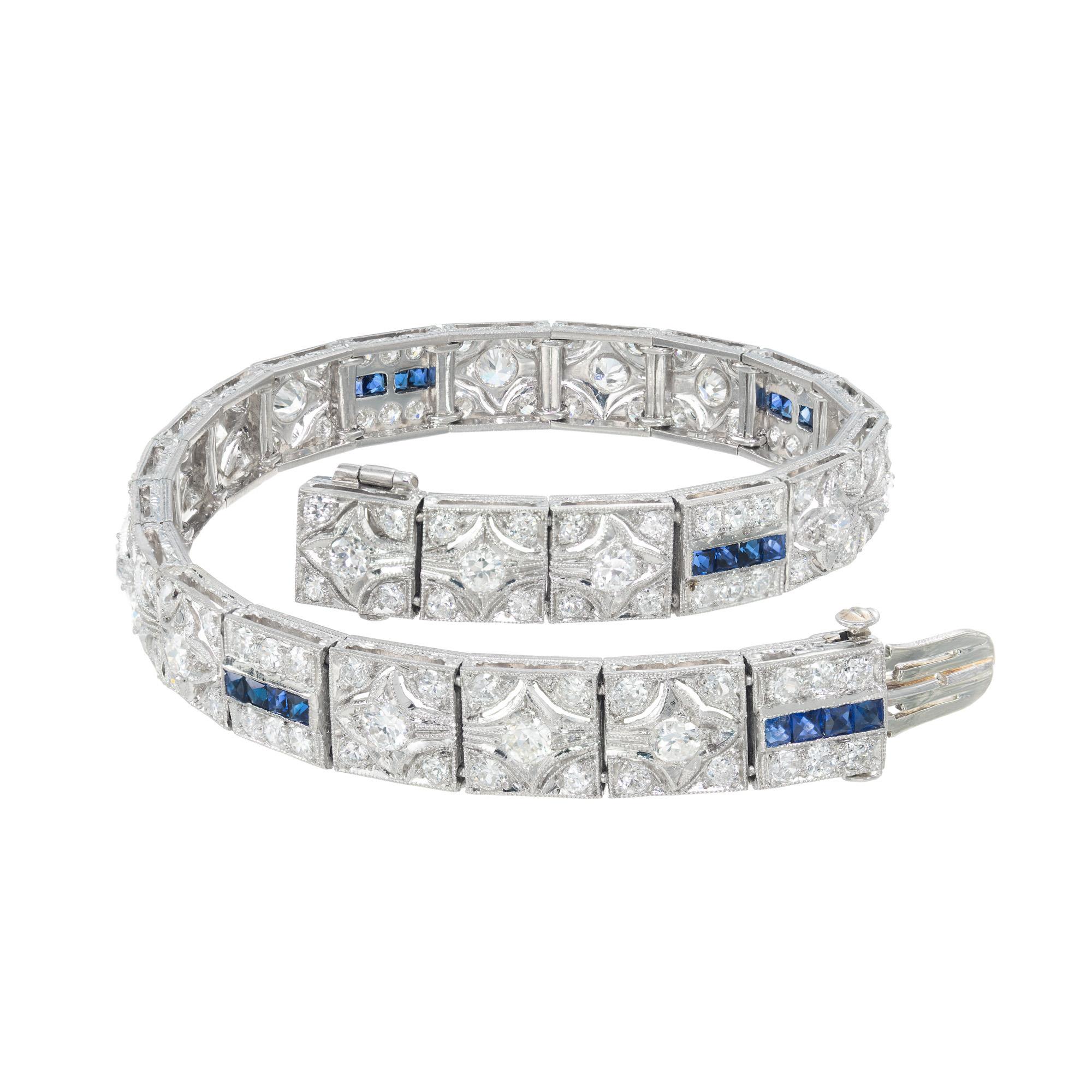 Original 1920s handmade diamond and sapphire solid hinged Platinum bracelet. Set with 126 round cut diamonds with a total carat weight of 4.68cts and 24 calibre cut sapphires with a total carat weight of .80cts.  Complete with hand engraved sides,