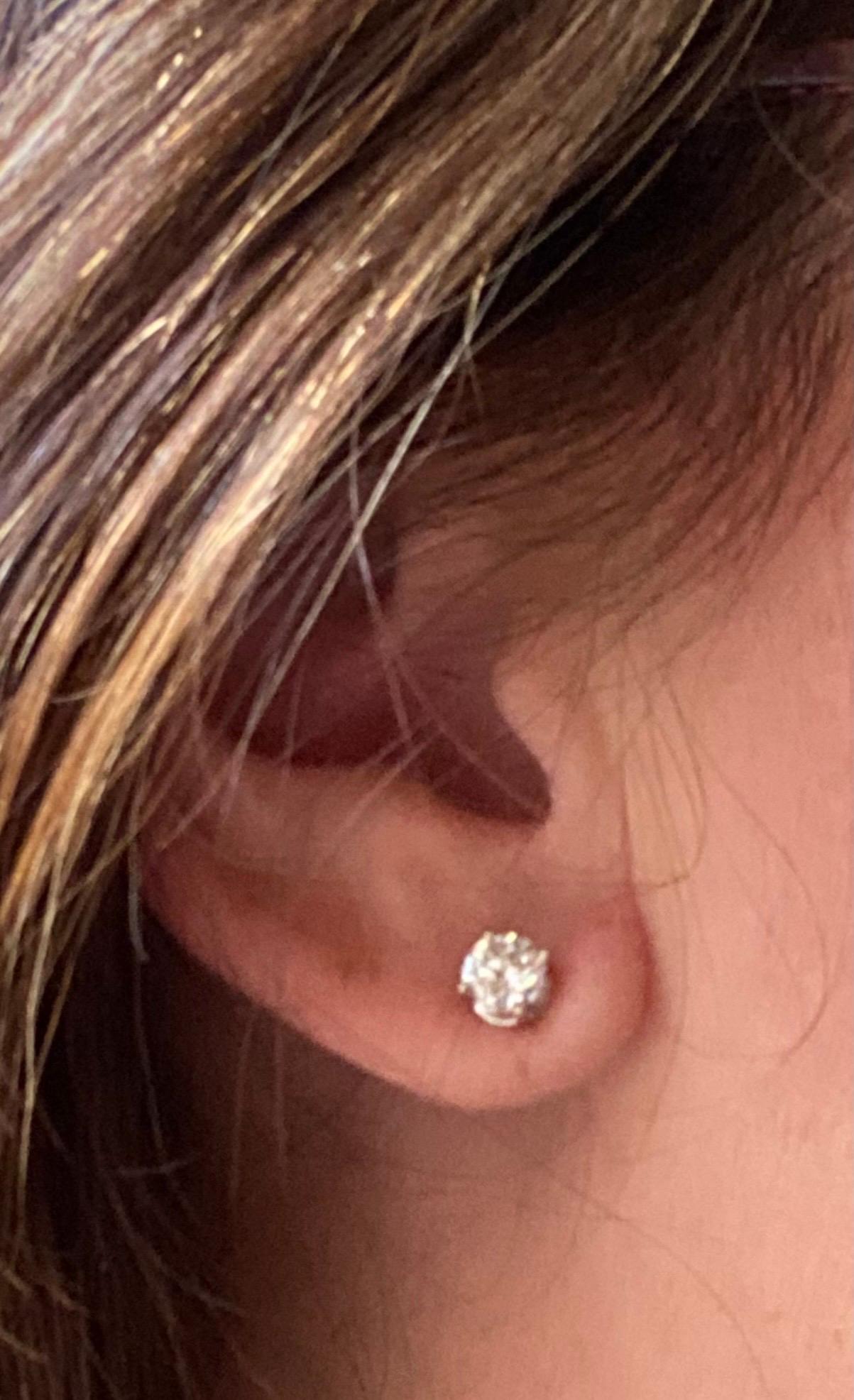Perfect size and extremely brilliant, these lovely Diamond studs set in 14kt White Gold one is 0.72ct E Color (colorless) and the other is 0.74ct F Color (colorless) and SI Clarity (slightly included). These are new and ready to ship. Comes with an