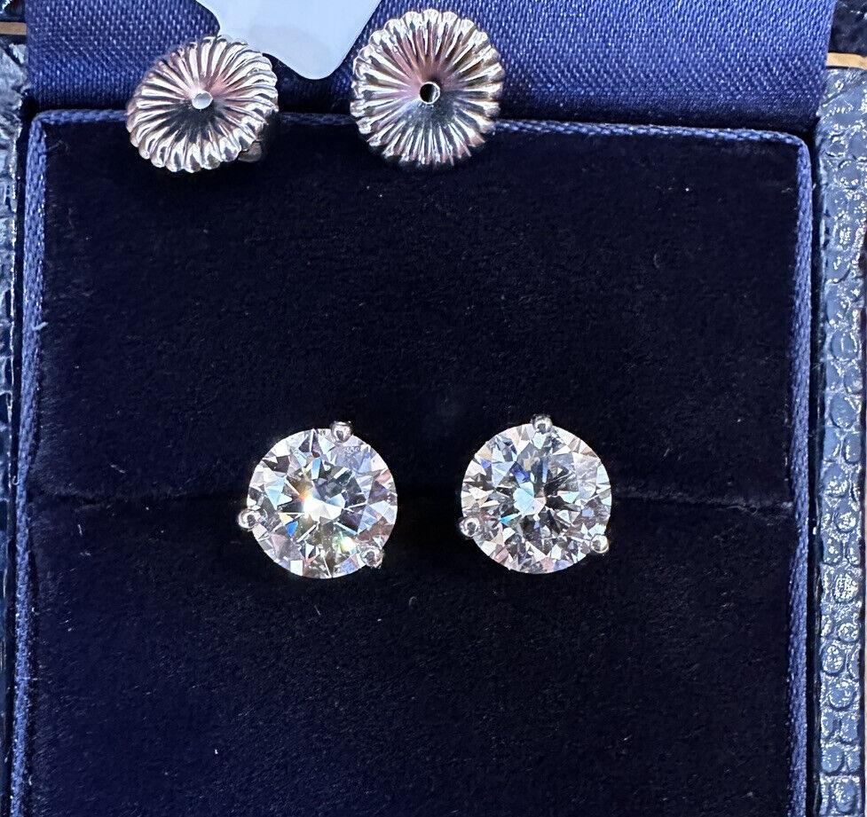 GIA certified Round Diamond Stud Earrings in White Gold. 4.14 carats 

These Round Diamond Stud Earrings, are a dazzling ensemble totaling 4.14 carats and are GIA certified with unparalleled quality.  
(See copy of certificate in photo