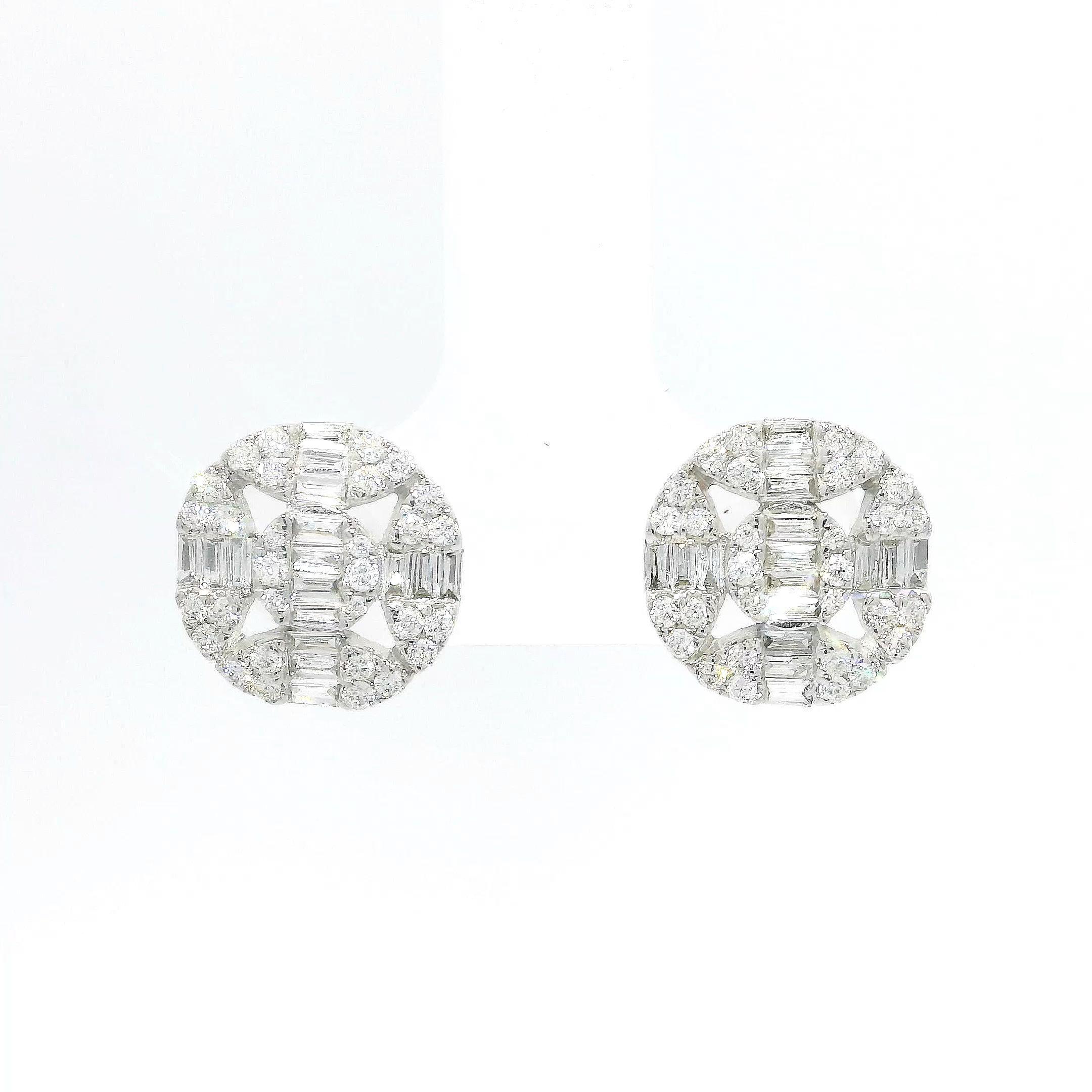 Beautiful and luxurious, these unique diamond earrings are sure to garner attention and make a lasting impression. Crafted from 18K white gold, the frame delicately holds an arrangement of the highest quality gems. A total of 0.73 carats of