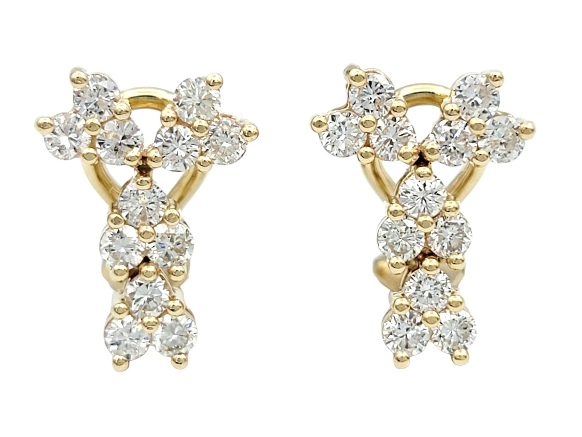 These shimmering diamond earrings, set in lustrous 14 karat yellow gold, showcase a charming trio cluster formation that adds both brilliance and visual interest. The scattered arrangement of sets of three diamonds on each earring creates a playful