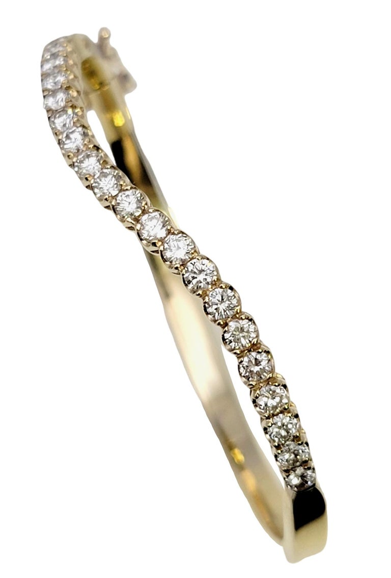 Round Diamond Wave Oval Hinged Bangle Bracelet in 14 Karat Yellow Gold