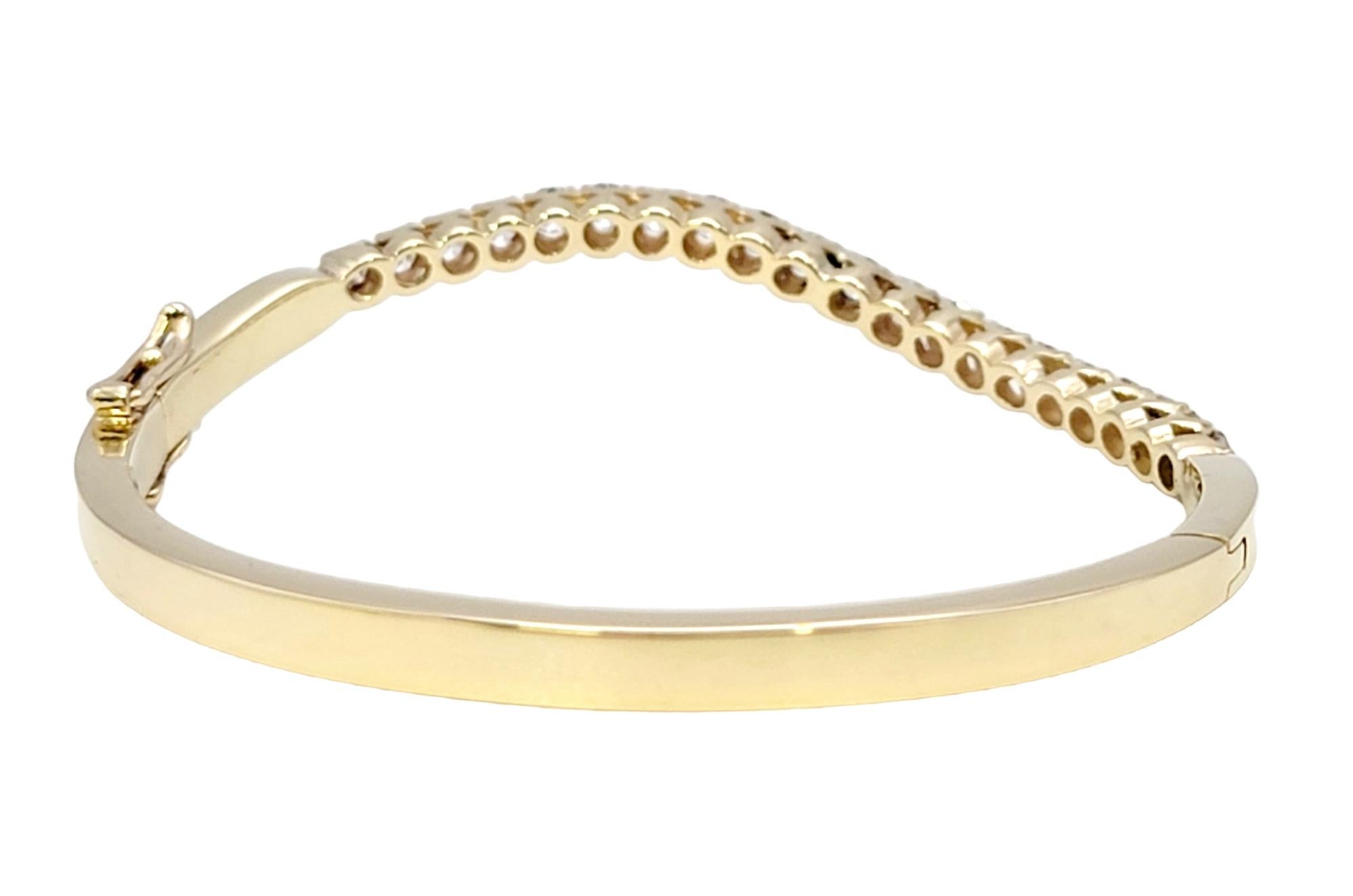 Women's Round Diamond Wave Oval Hinged Bangle Bracelet in 14 Karat Yellow Gold For Sale