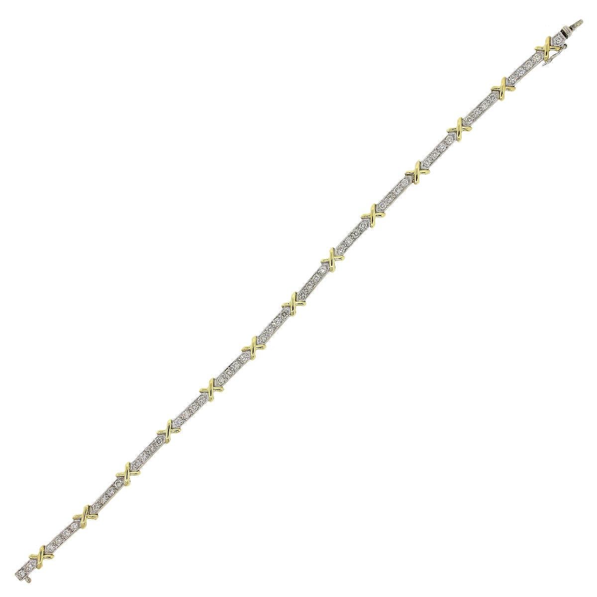 Material: 18k Yellow Gold and 18k White Gold
Diamond Details: Approximately 1.06ctw of round diamonds. Diamonds are G/H in color and VS in clarity
Total Weight: 10g (6.4dwt)
Bracelet Measurements: Will fit up to a 7″ wrist
Clasp Details: Tongue in