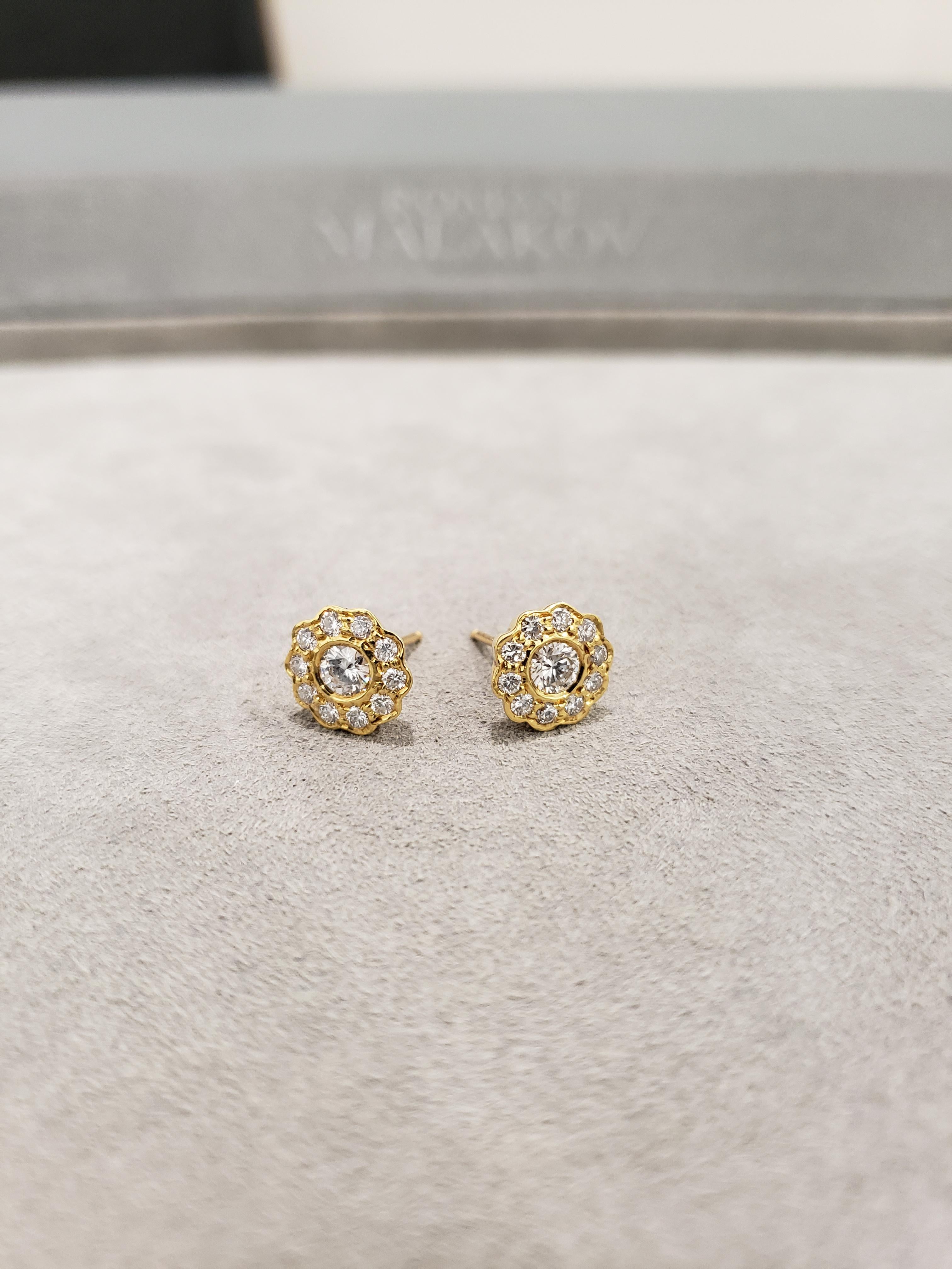Each earring showcases a round brilliant diamond, surrounded by smaller round brilliant diamonds. Set in 18 karat yellow gold. Diamonds weigh 1.12 carats total.

Style available in different price ranges. Prices are based on your selection of the