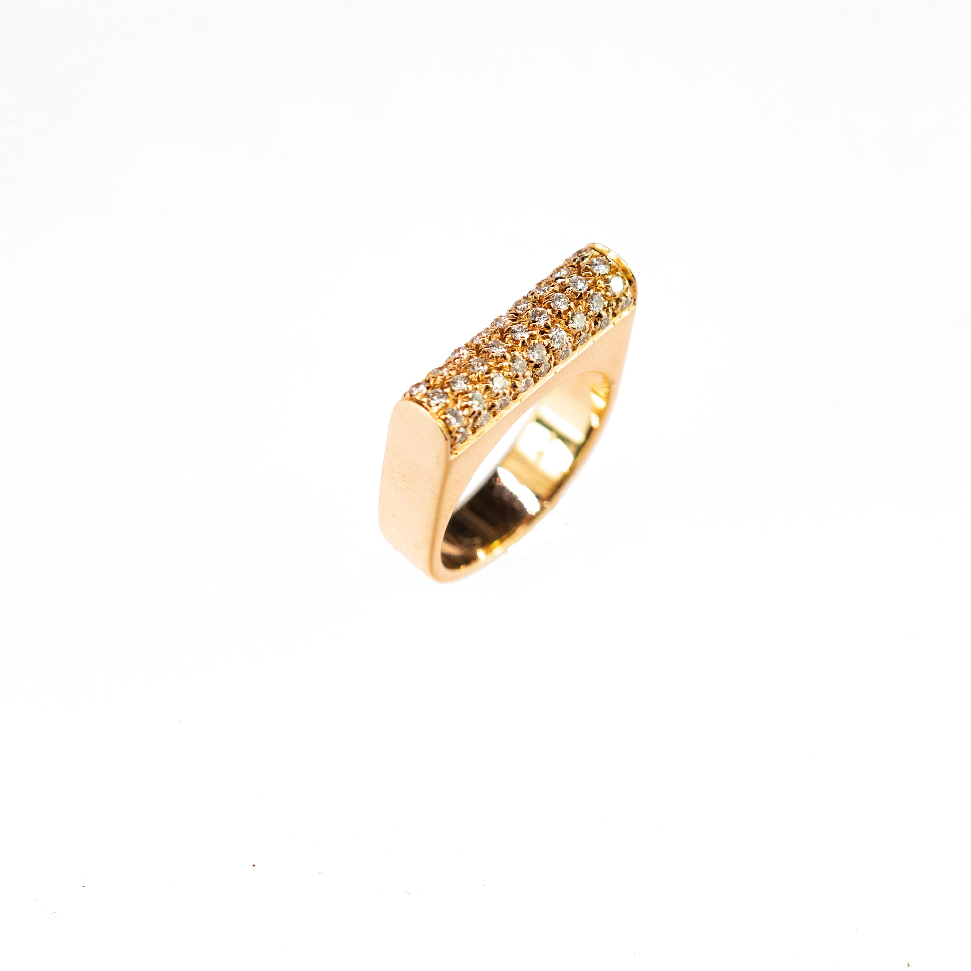 Vintage diamonds cocktail gold ring.

This charming yellow gold ring with gently cut diamonds in a cylindrical shape is seated in a semi square ring. This ring is inspired by the simplicity of glamour and the authenticity that will give any woman an