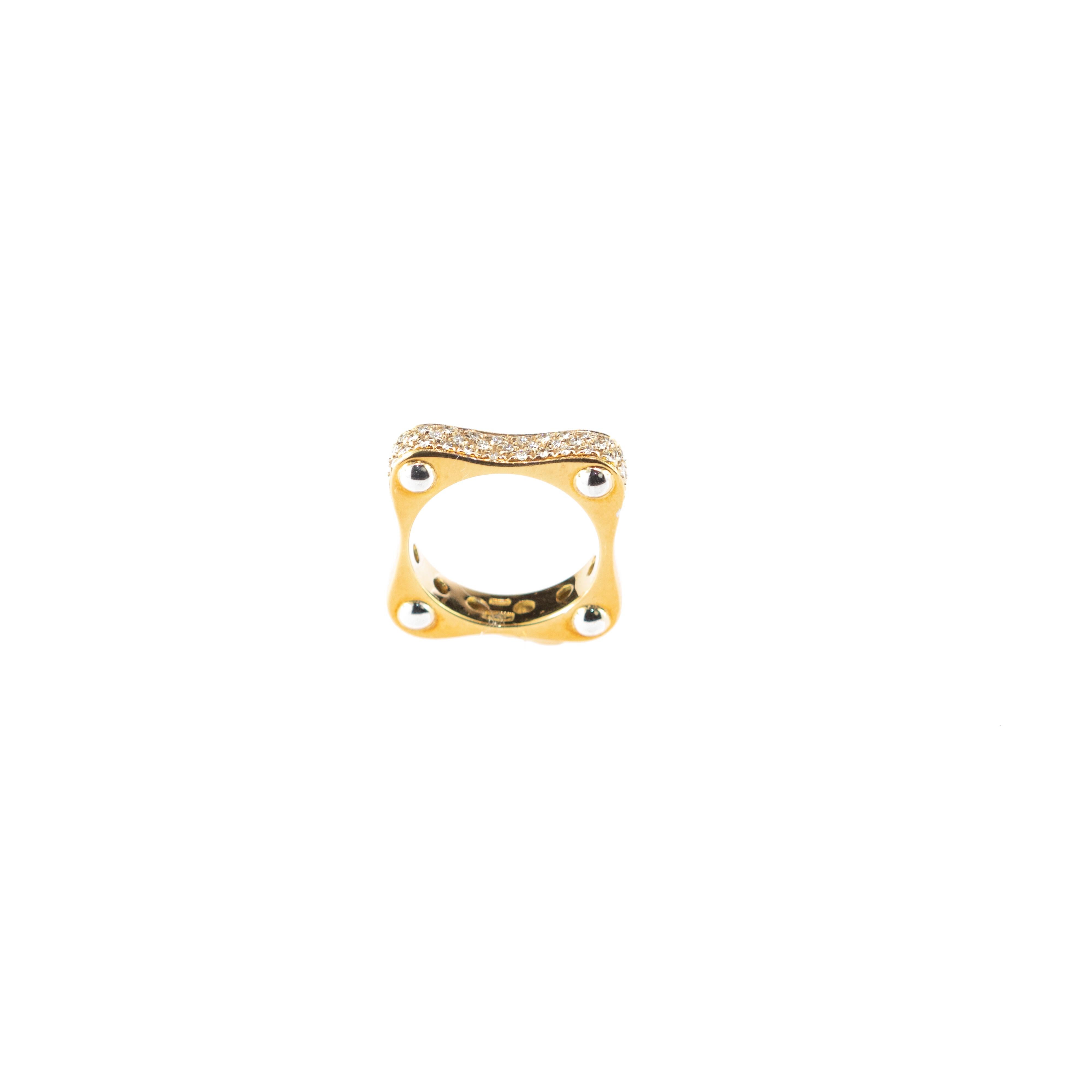 A piece of art only suitable for a risky person willing to break stereotypes.This unique and mysterious design is inspired by minimalism tendences. 

A 18 karat yellow gold ring that offers on its upper part a set of diamonds that faithfully perch