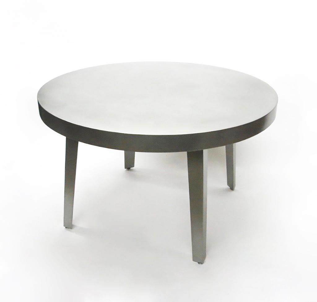 Round dining or center table of strong quality in brushed stainless steel with a 3 1/8