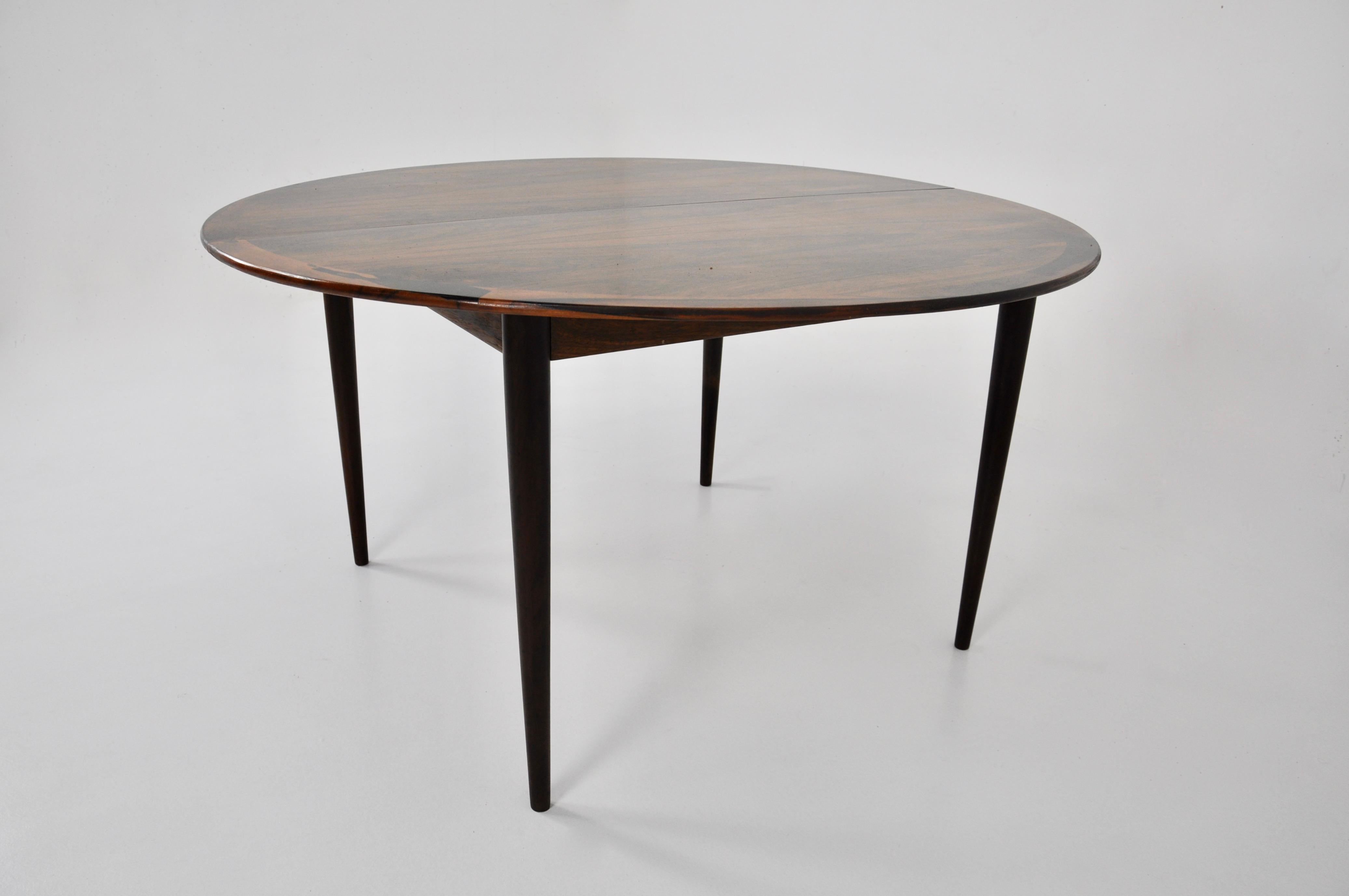 Extendable wooden table. Max width: 245 cm. Stamped Grete Jalk and Cj Rosengaarden. Wear due to time and age of the table.
  