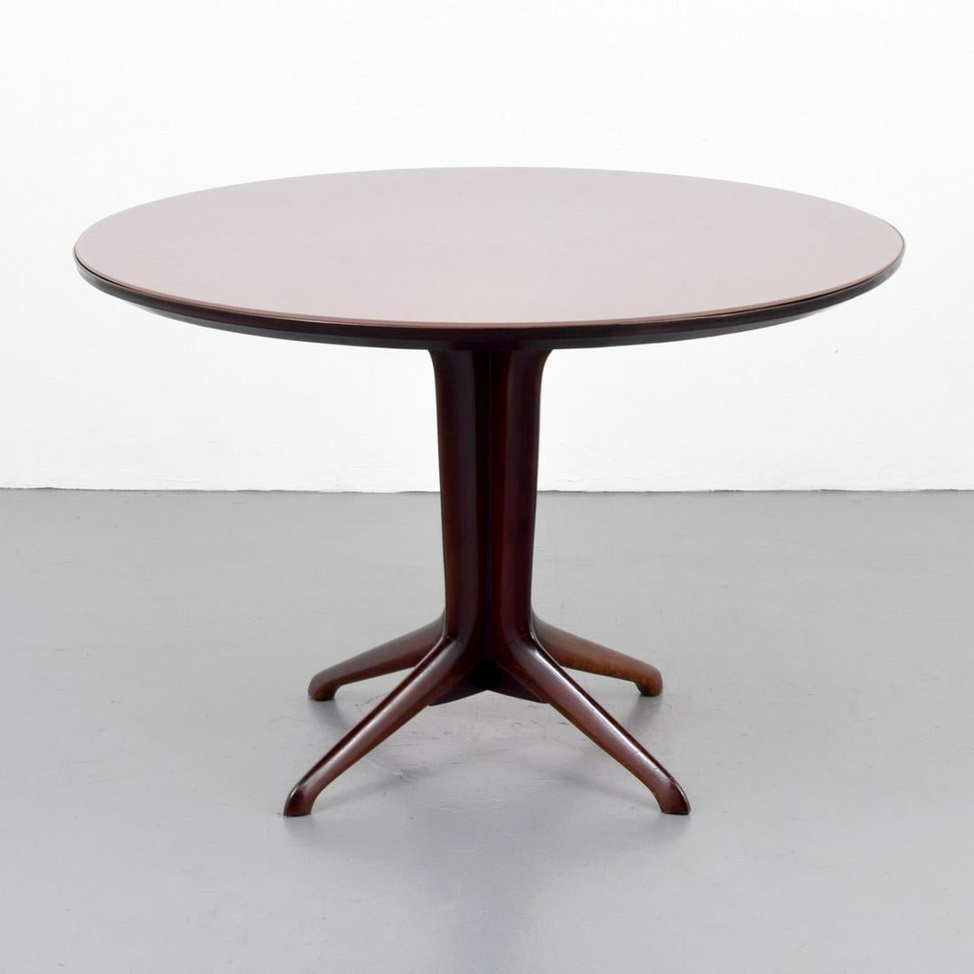 Round wooden dining table with glass top by Ico Parisi.