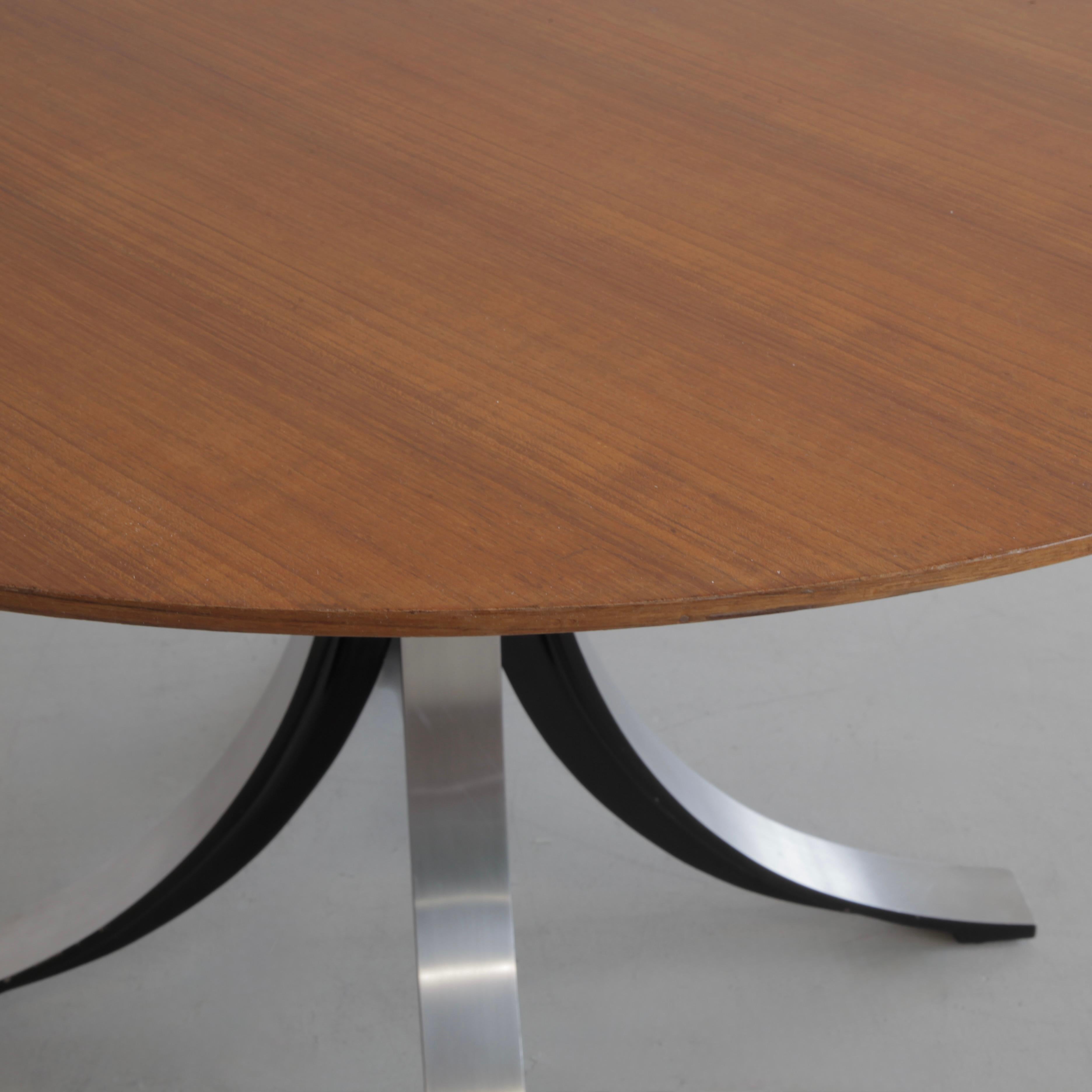 Round Dining Table (T69A) designed by Osvaldo Borsani and Eugenio Gerli in 1963/64. Produced by TECNO.

Brushed metal base with the inner sides finished in matt black enamel. Wooden top with bevelled edges. TECNO label on base.

Literature:

-