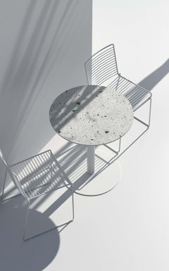 Tavolo da pranzo rotondo 'I' in Terrazzo Bianco