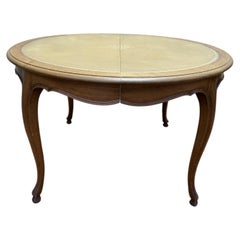 Round dining table in oak and leather Louis XV style