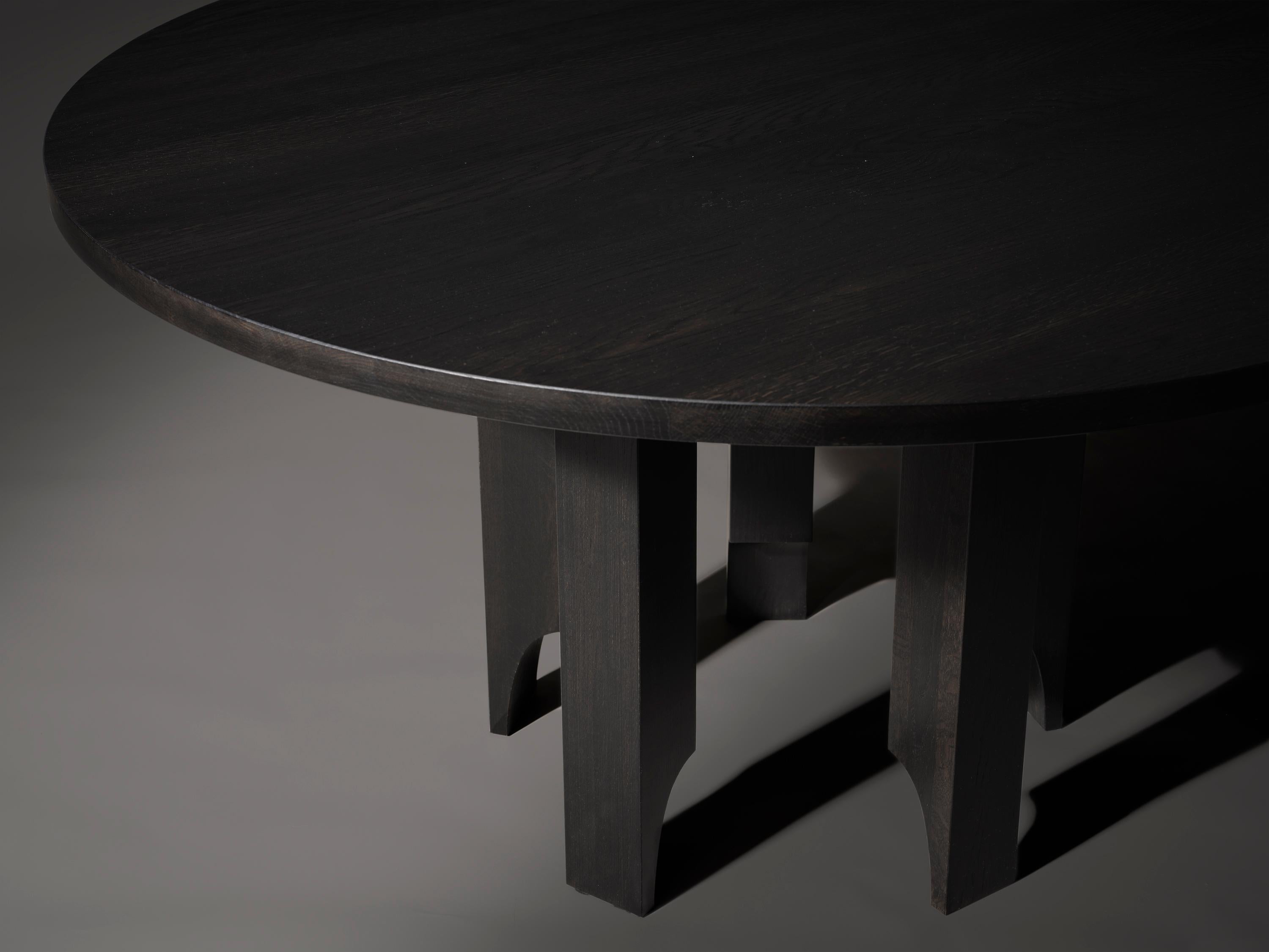 Bringing lightness and elegance to its heavy materials and shapes. The Acer Table is a balancing act between its heavy solid volumes and light pointing legs featuring semi arched voids. Designed by Aad Bos and crafted in the Netherlands. 

Mokko