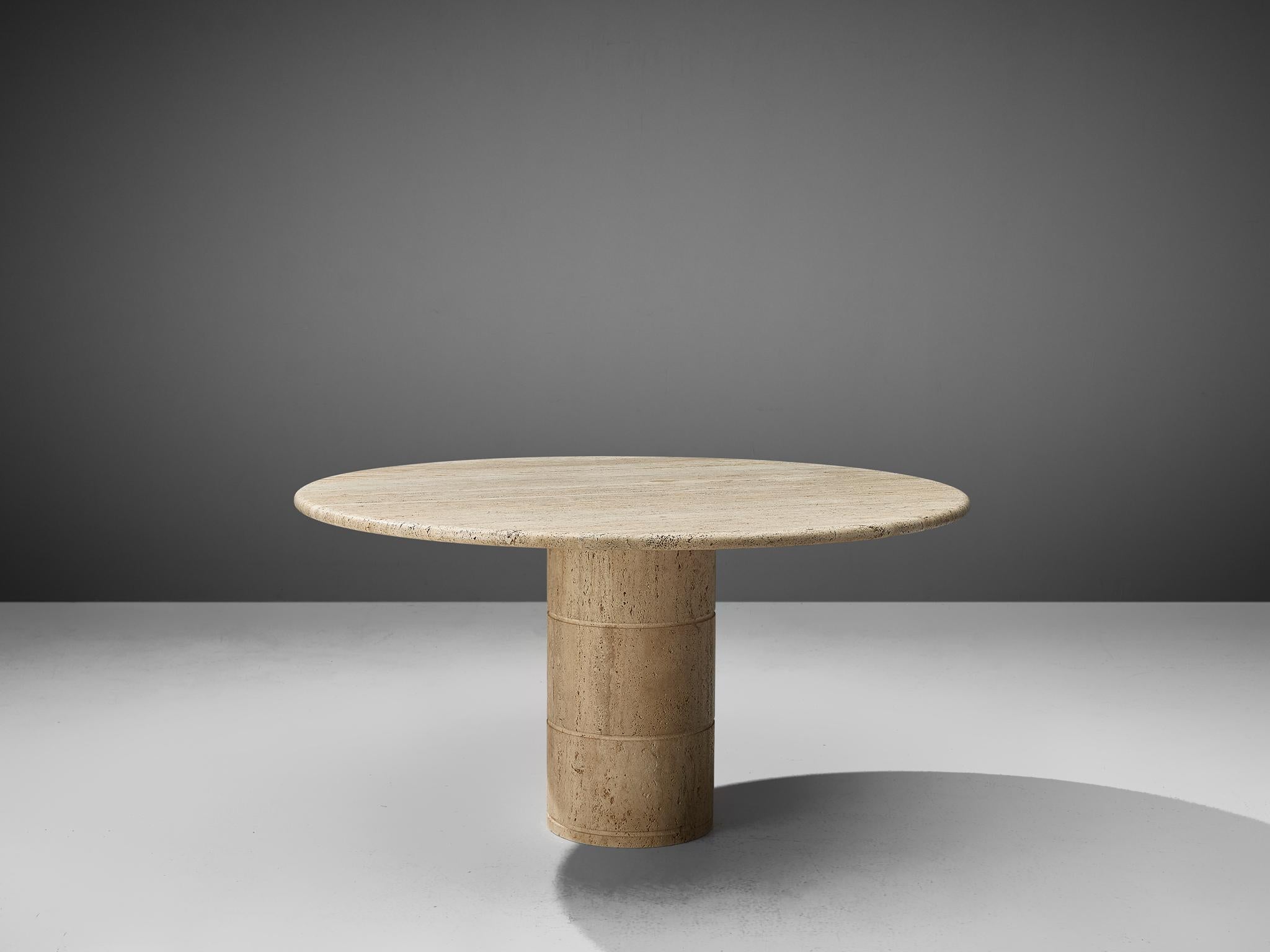 Dining table, travertine, Europe, 1970s.

This solid dining table features a colon, cylindrically shaped foot and a thick circular travertine tabletop. The aesthetics are archetypical for postmodern design, bearing references to architectural forms