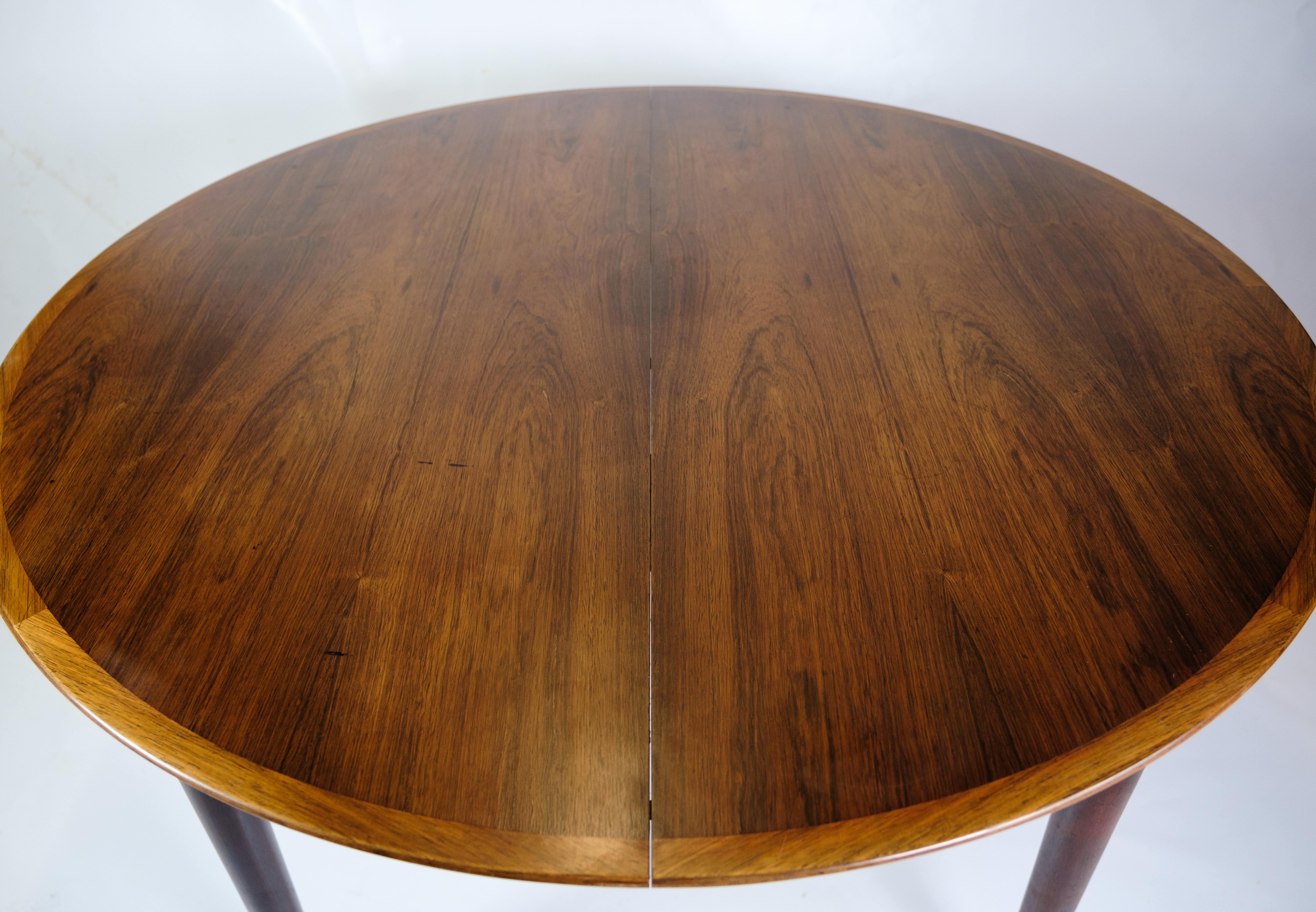 *PRICE INCLUDES FULL REFINISH OF THE ENTIRE ITEM*

This round rosewood dining table, designed by renowned Danish furniture designer Arne Vodder in the 1960s, represents an outstanding example of Scandinavian craftsmanship and design. Made from