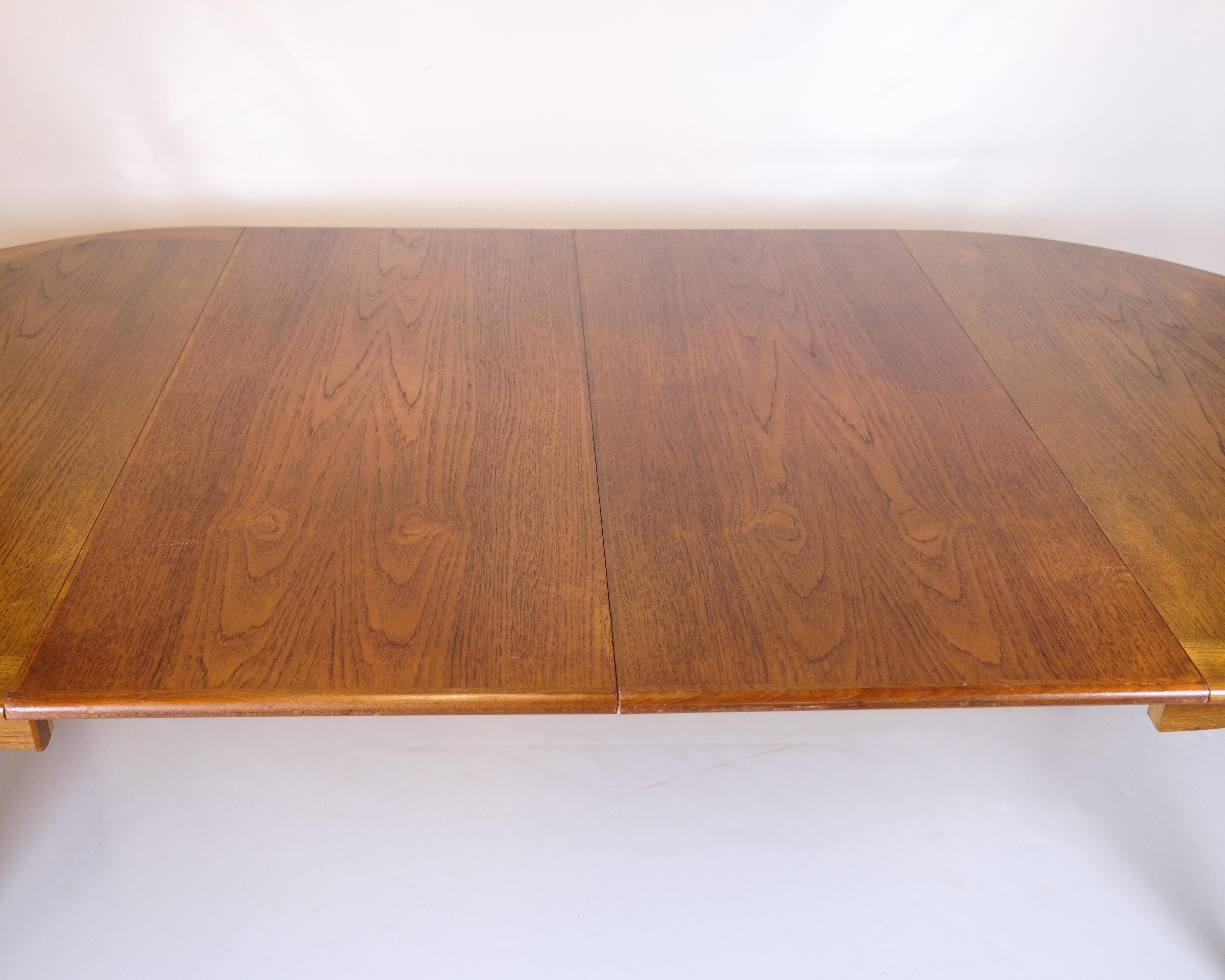 Tavolo da pranzo rotondo con foglie allungabili in teak degli anni '60 in vendita 7