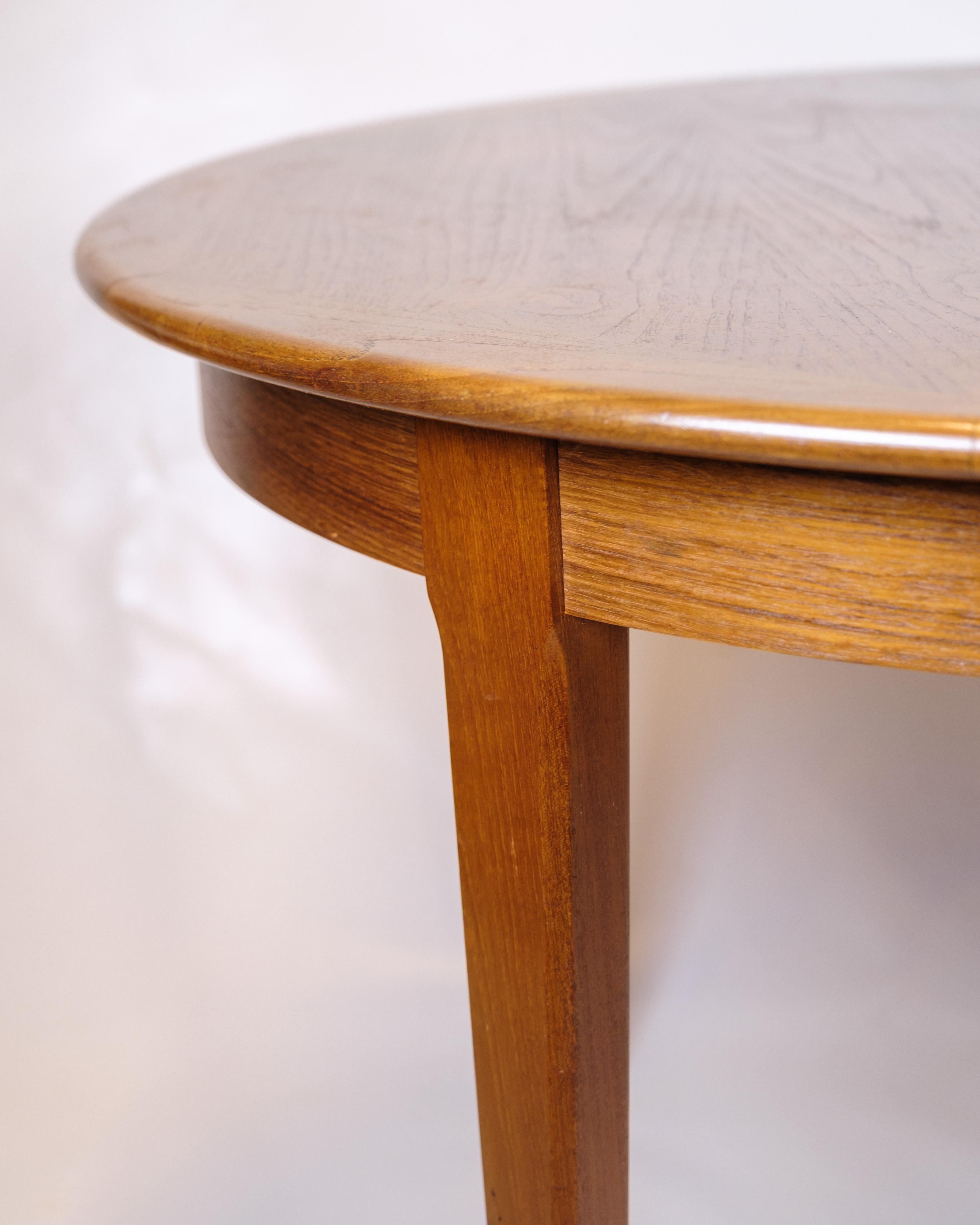 Metà XX secolo Tavolo da pranzo rotondo con foglie allungabili in teak degli anni '60 in vendita