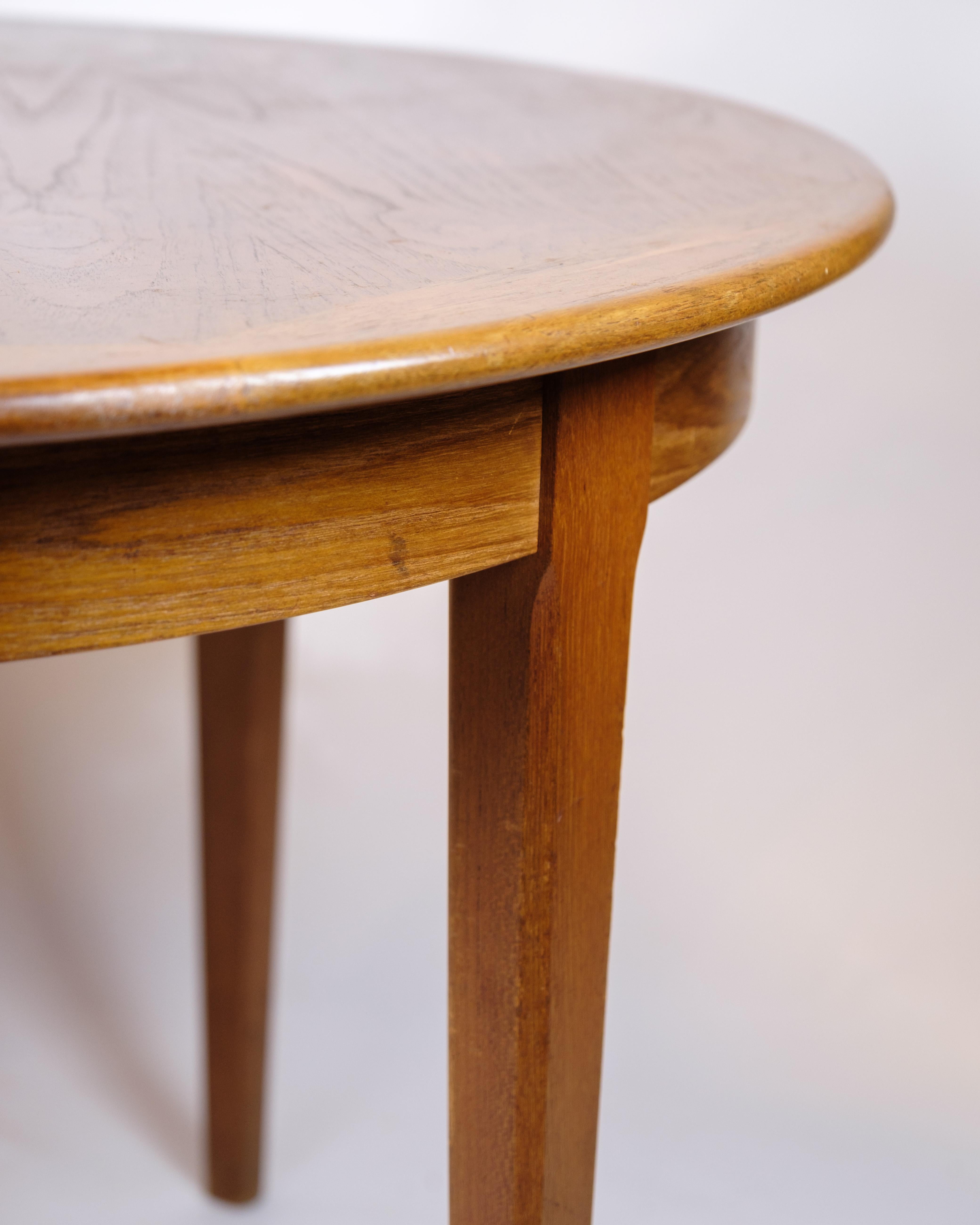 Tavolo da pranzo rotondo con foglie allungabili in teak degli anni '60 in vendita 1