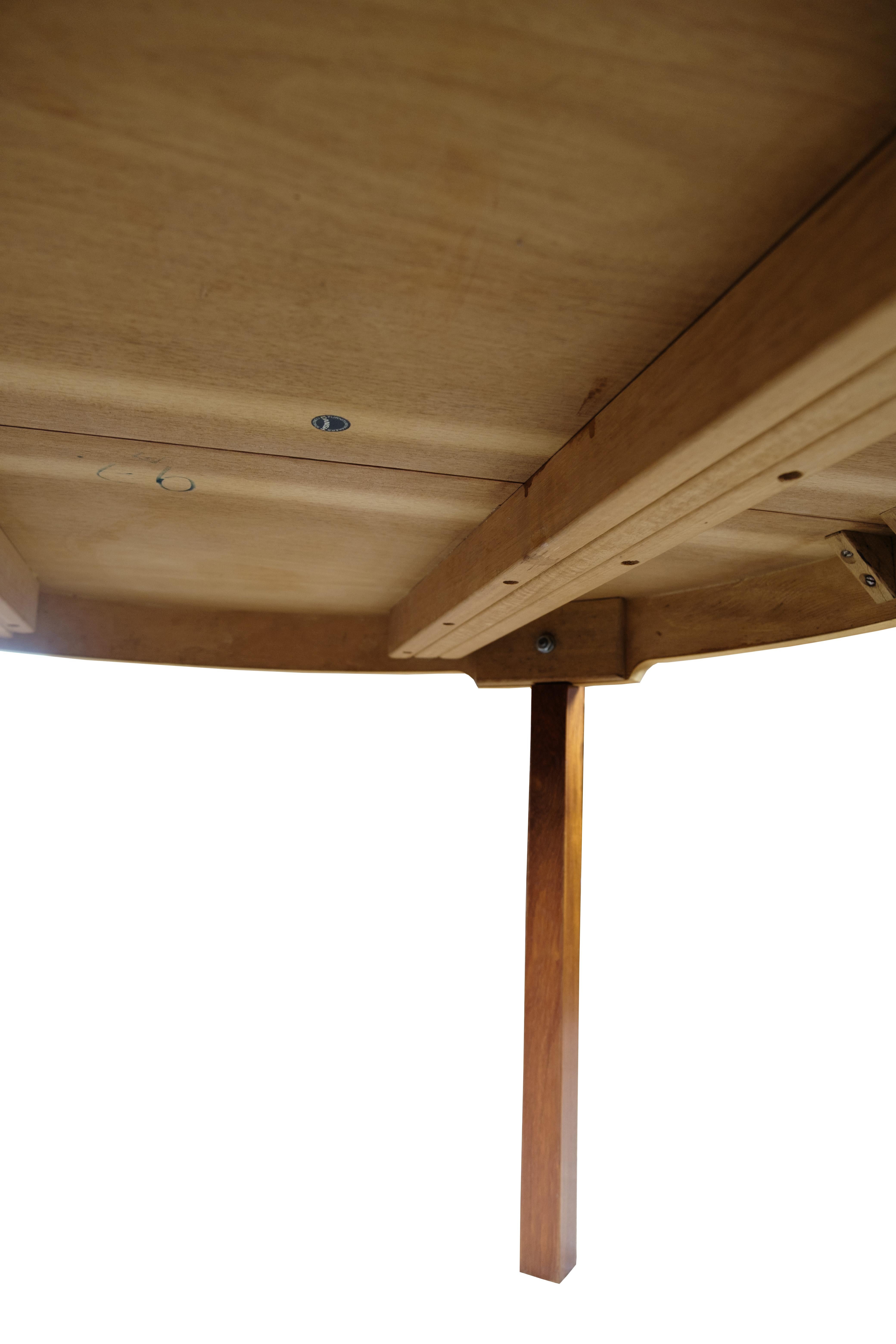 Tavolo da pranzo rotondo con allunghe in teak, design danese degli anni '60 in vendita 1