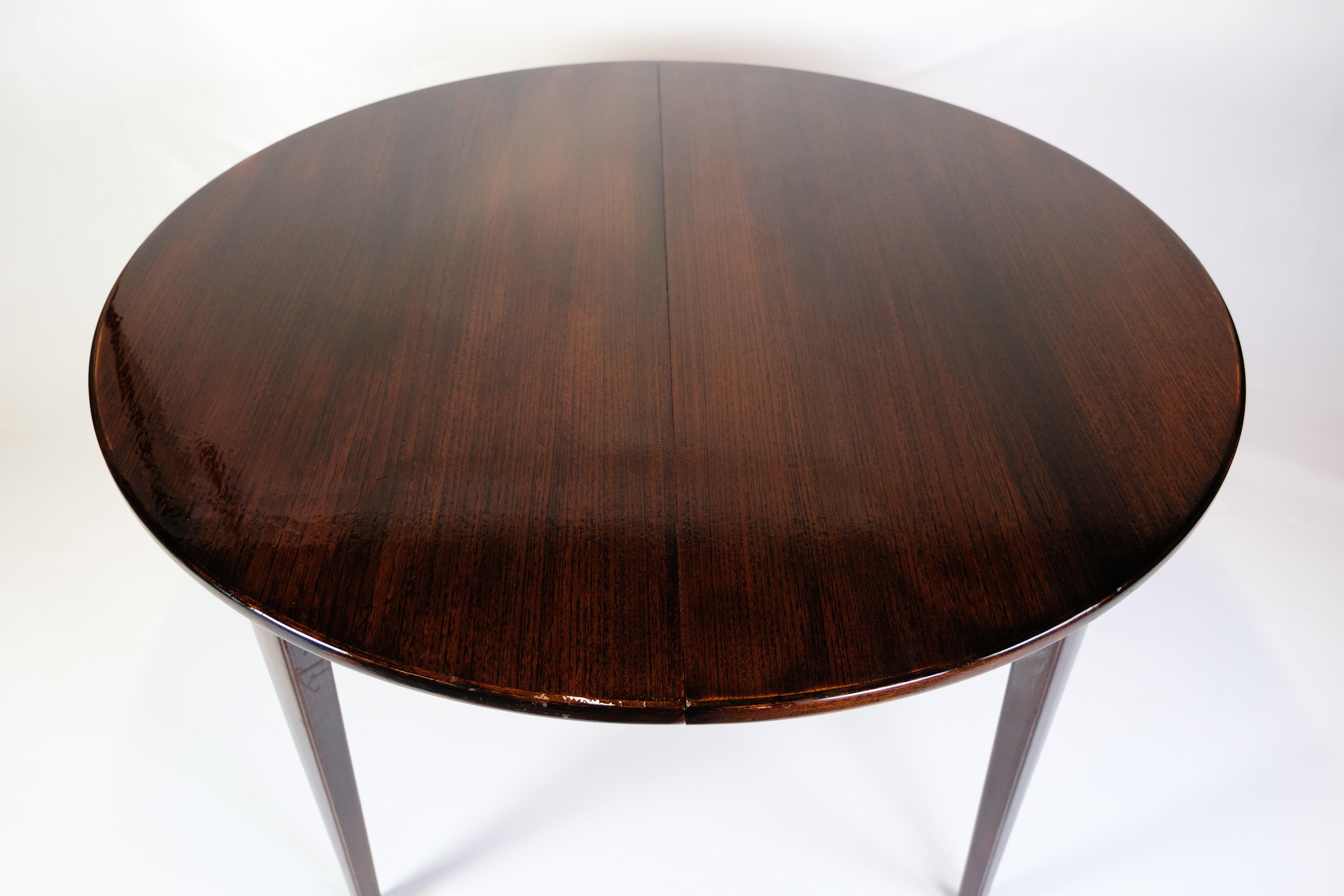 Mid-Century Modern Round Dining Table With Extensions Model 55 Made In Mahogany By Omann Junior For Sale