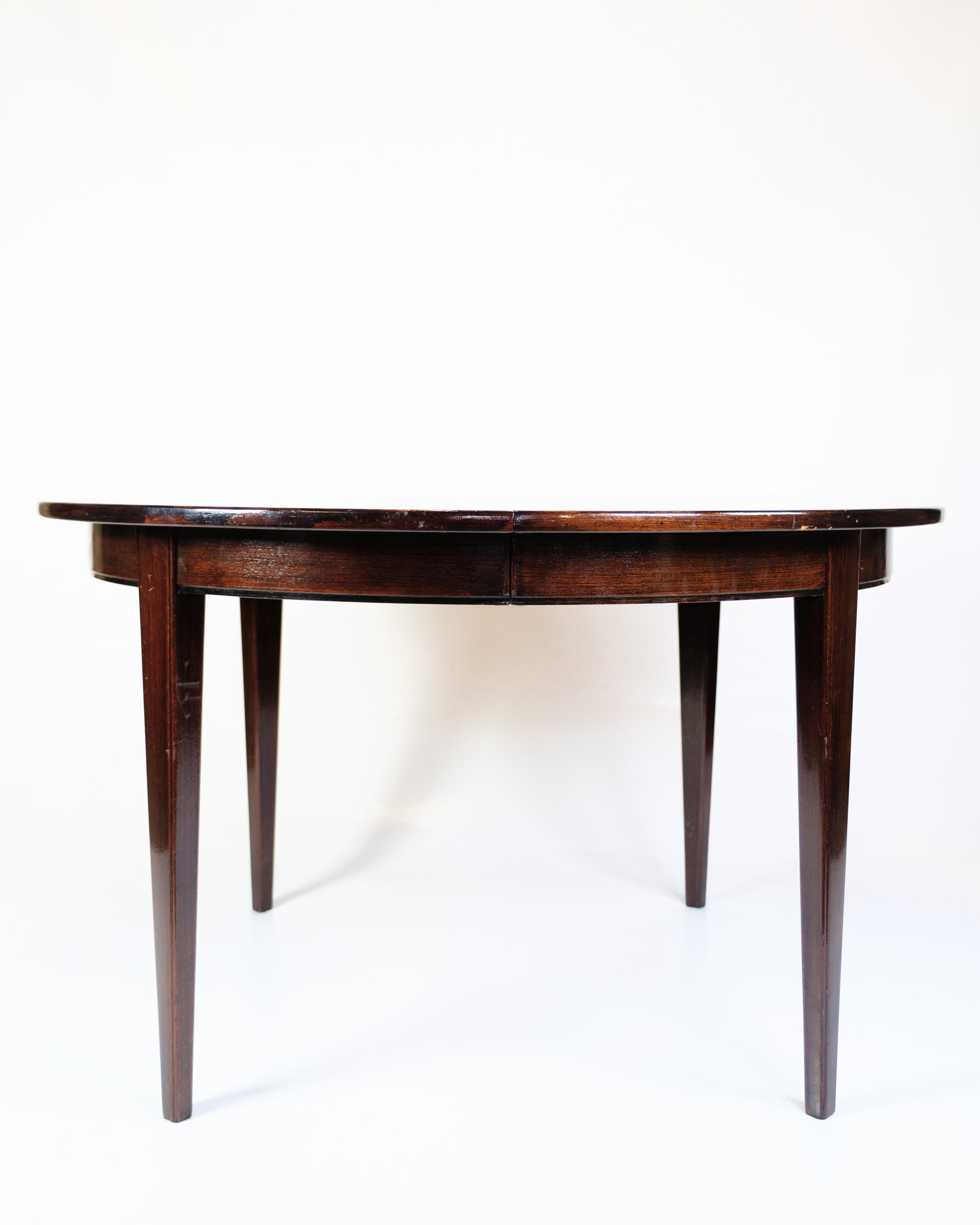 Danish Round Dining Table With Extensions Model 55 Made In Mahogany By Omann Junior For Sale