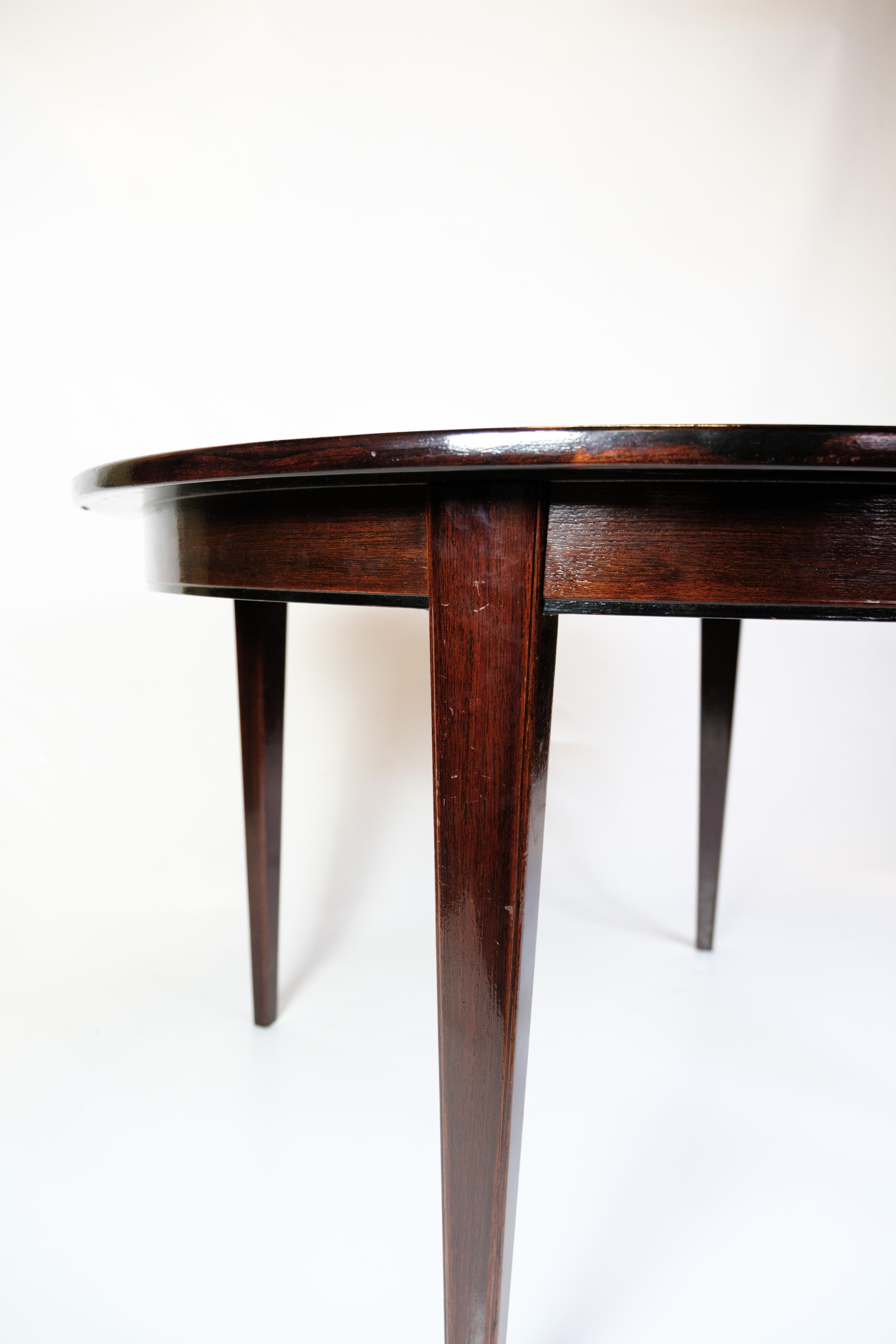 Mid-20th Century Round Dining Table With Extensions Model 55 Made In Mahogany By Omann Junior For Sale