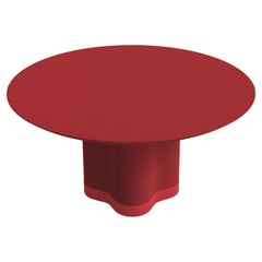 Tavolo da pranzo rotondo con base scultorea in laccato rosso ciliegio