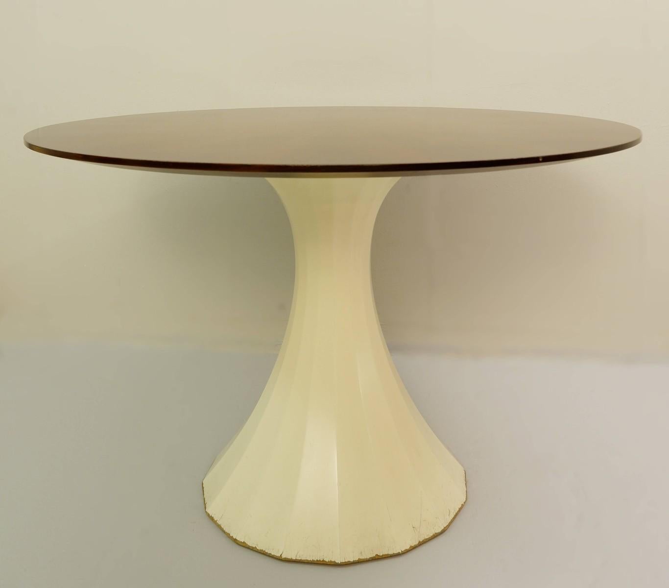 Round dining table with star veneered top.