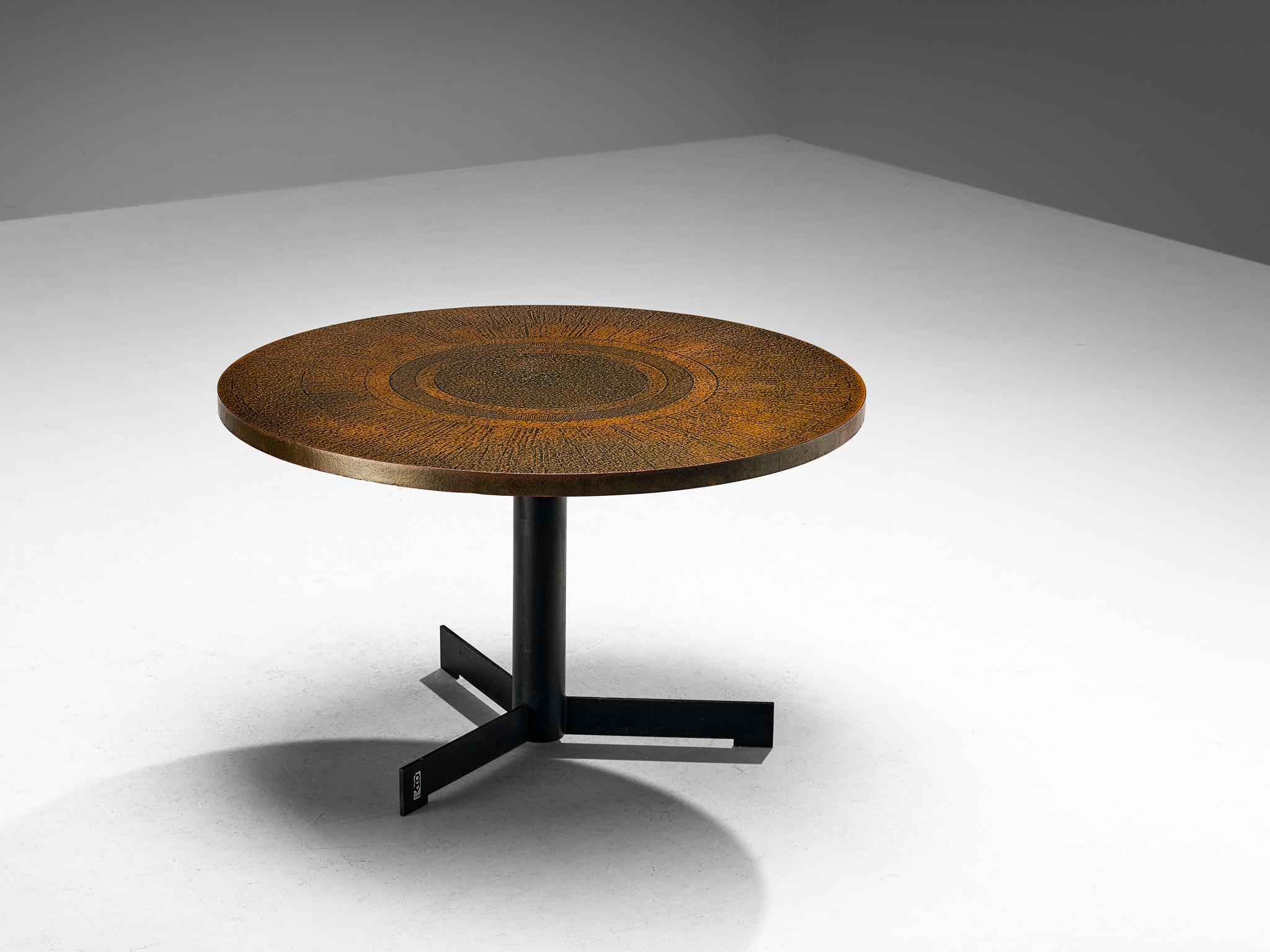 Dining table, formica, coated iron, Europe, 1970s

This circular dining table adheres to a minimalist design approach while skillfully interweaving a captivating interplay of materials and textures. The tabletop presents a striking visual with its