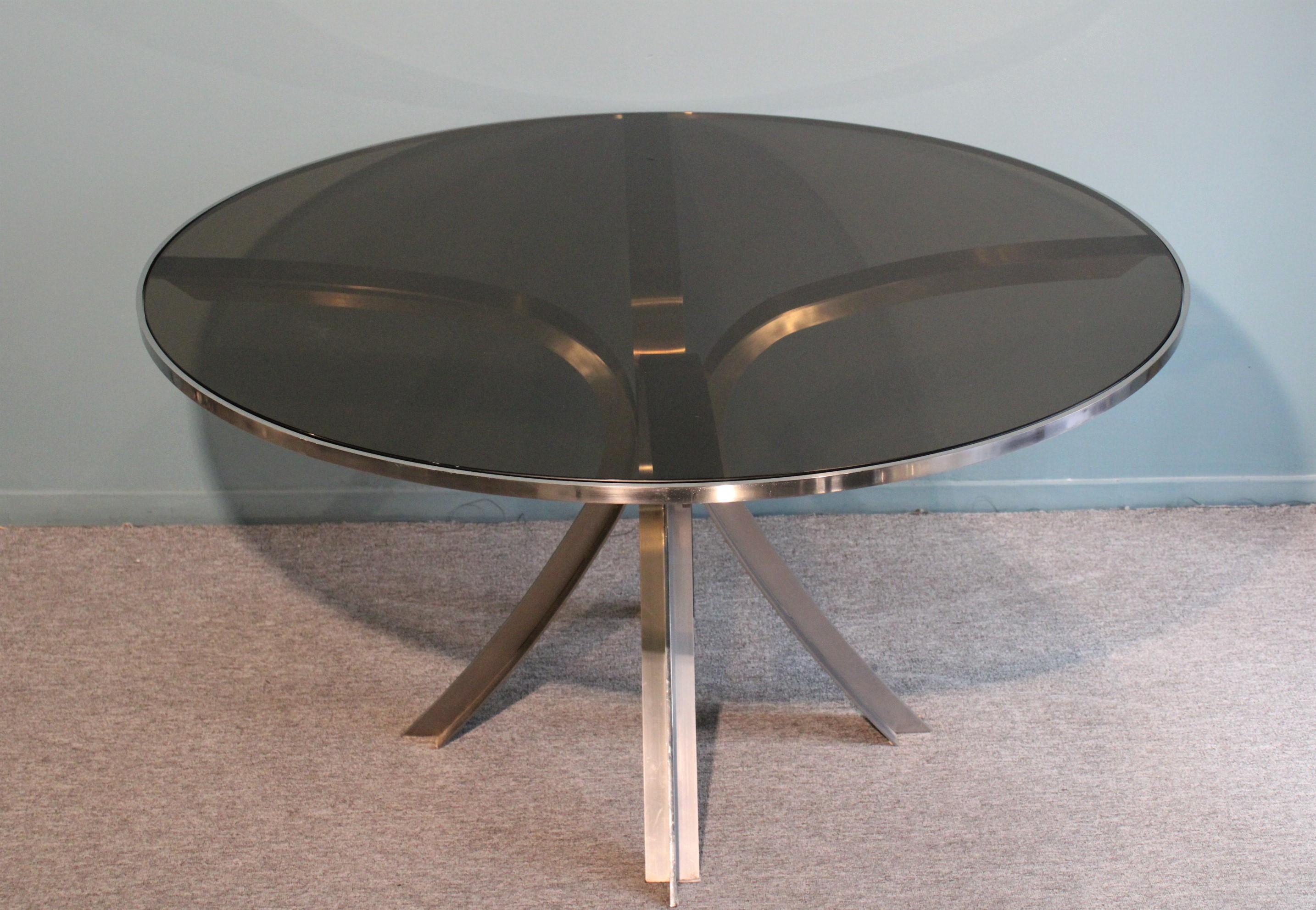 Dinning table by Xavier Féal.
Smoked glass top and stainless steel base.
Circa 1970.