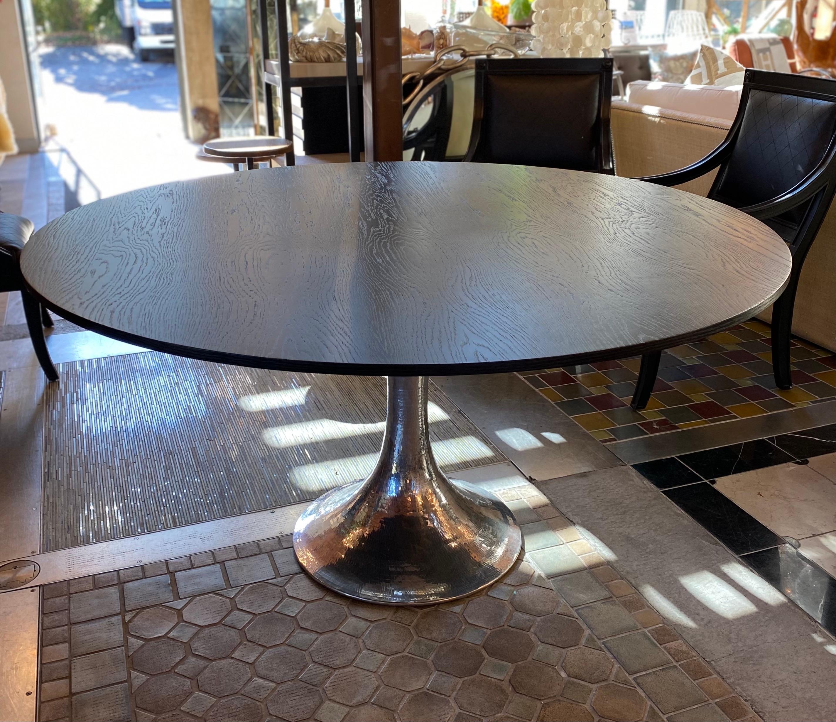 Round dinning table dark wood with chrome base

Measures: 60