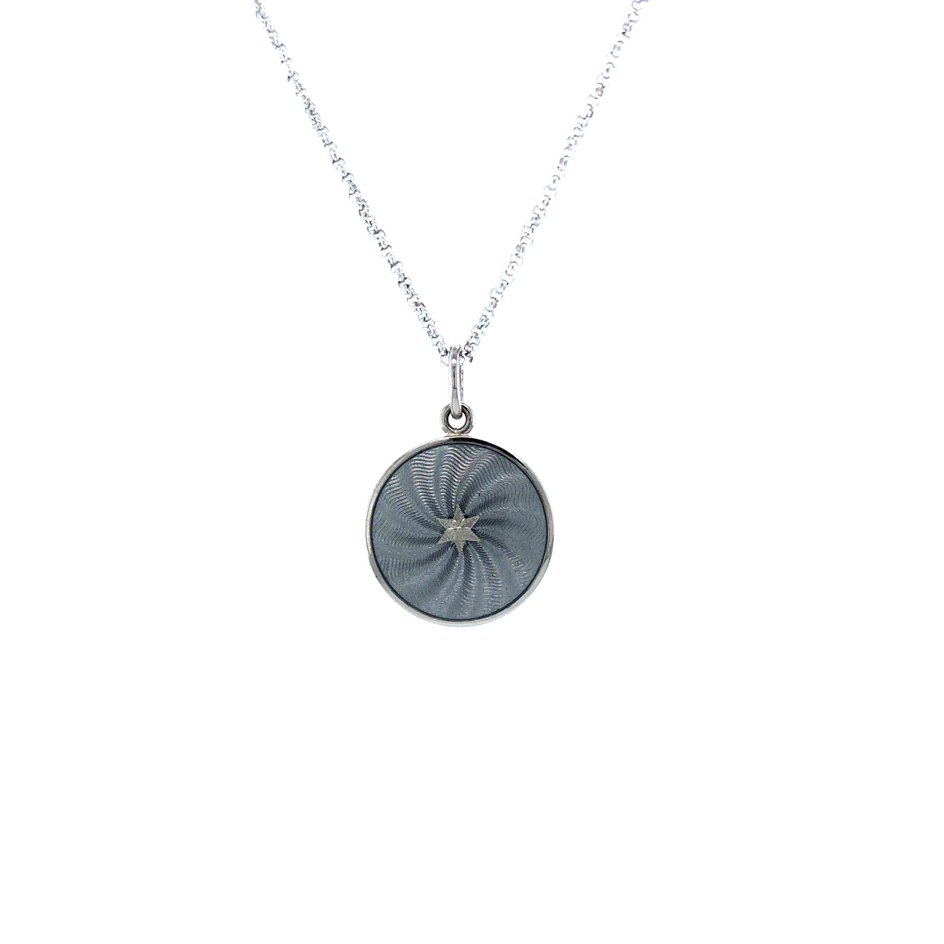 Round disk pendant necklace 18k white gold, Diskos Collection, translucent silver vitreous enamel, guilloche, gold paillons, diameter app. 15.0 mm 

About the creator Victor Mayer
Victor Mayer is internationally renowned for elegant timeless designs