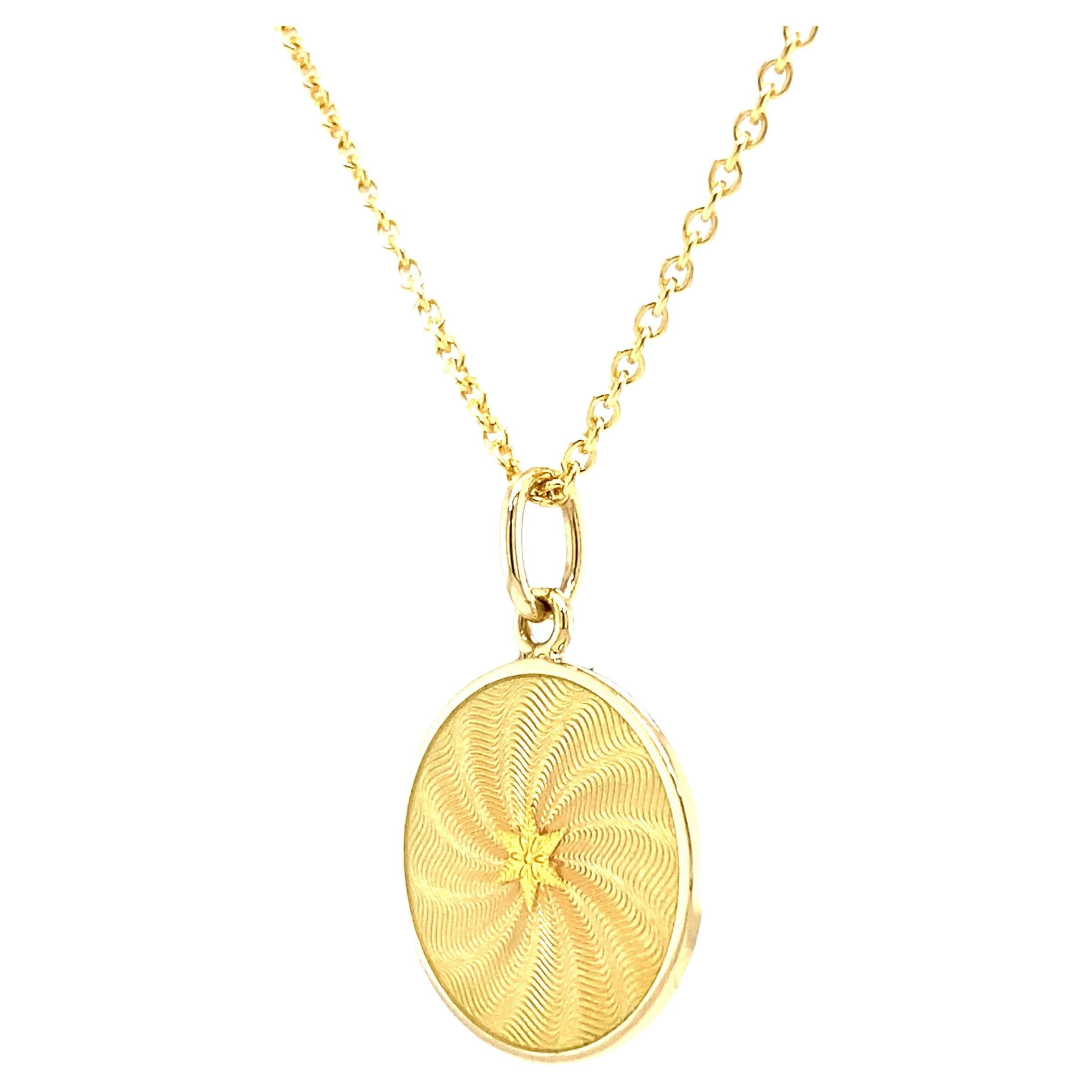Victor Mayer round pendant necklace with star 18k yellow gold, Diskos Collection, yellow vitreous guilloche enamel with ornamental paillons in the shape of a six-rayed star, diameter app. 15.0 mm

About the creator Victor Mayer
Victor Mayer is