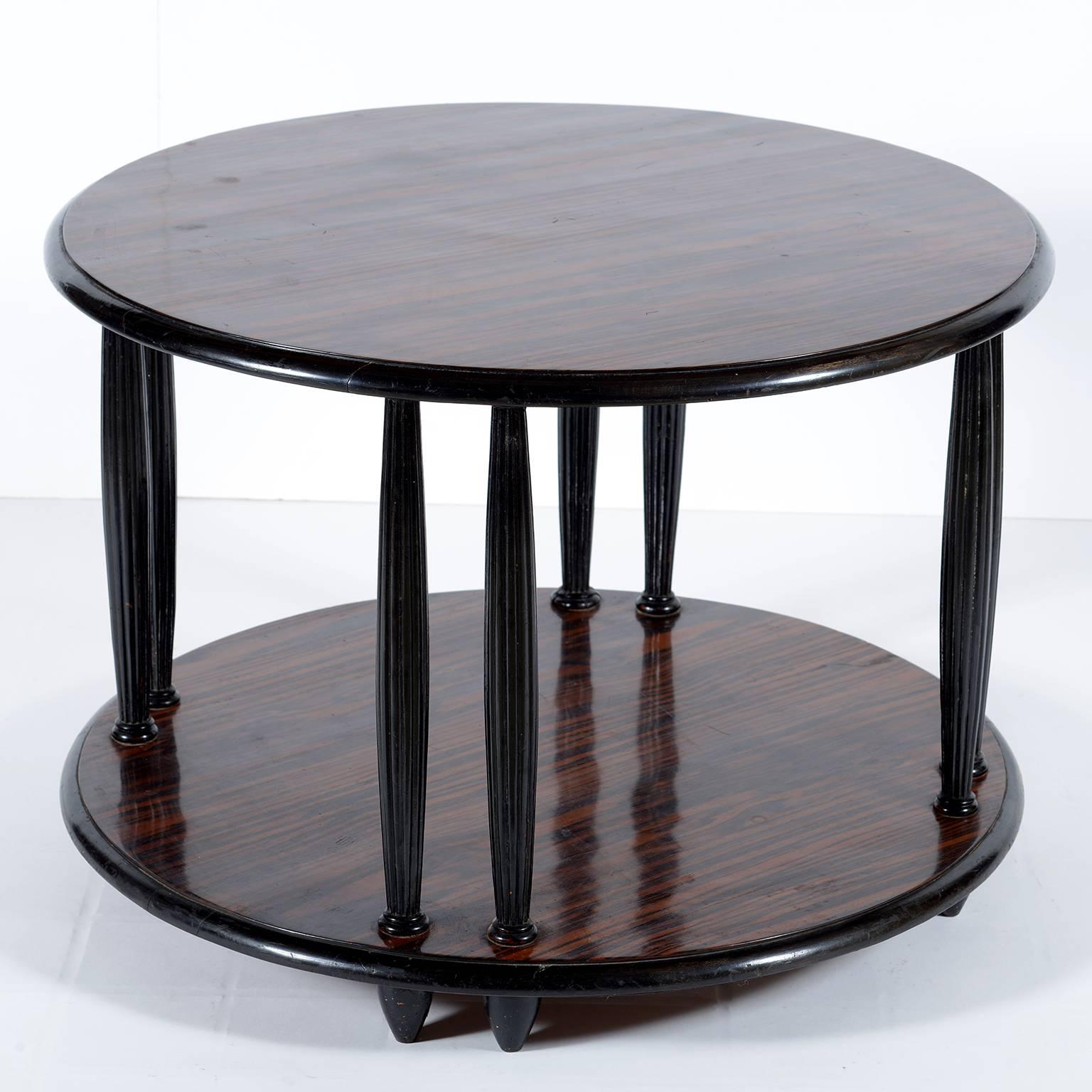 Black lacquered wood and important beautiful exotic wood round side or coffee table.
Double grooved legs in every side.
The low shelf give opportunity to put magazine or books under the top.
 