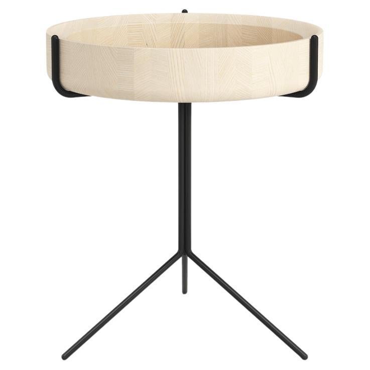 The Drum side tables for Scandinavian company Swedese feature beautifully hand turned bowls made from either natural, black or white stained solid ash that are presented within a black or white lacquered steel frame.

The frame consists of three