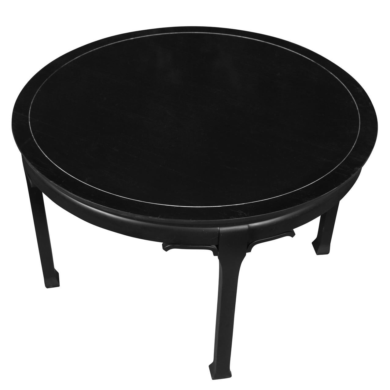 A round ebonized, mid century, Asian style center table.