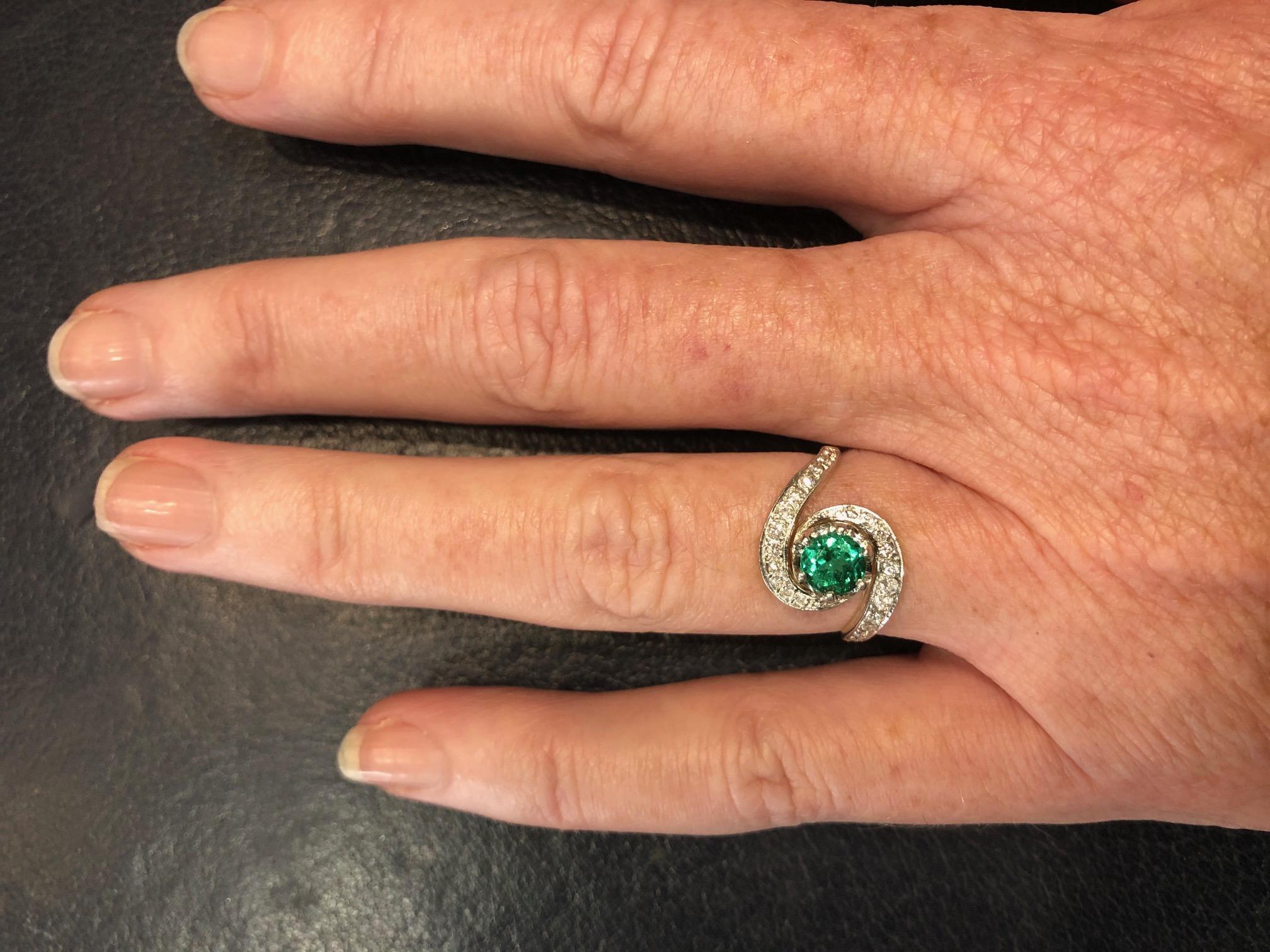 Emerald and Diamond Ring in 18ct White Gold and Yellow Gold, centre round Emerald 0.67ct and 24 brilliant cut diamonds totalling 0.30ct HSI2
Ring size M or 6.25 US - can be resized