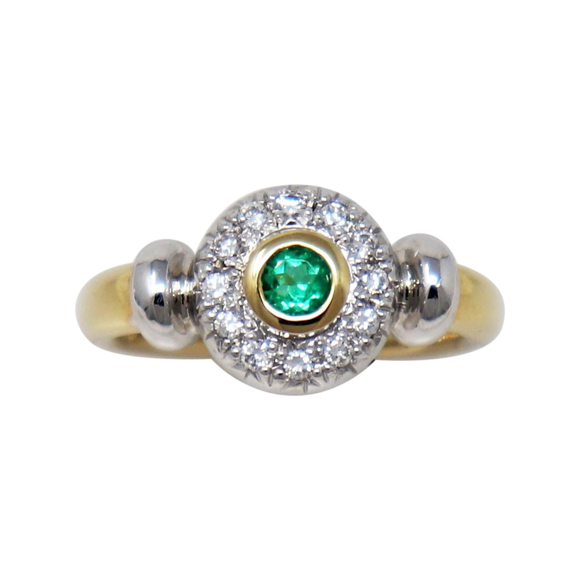 Round Emerald Bezel Set and Pave Diamond Halo Ring in Two Tone 14 Karat Gold For Sale