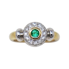 Round Emerald Bezel Set and Pave Diamond Halo Ring in Two Tone 14 Karat Gold