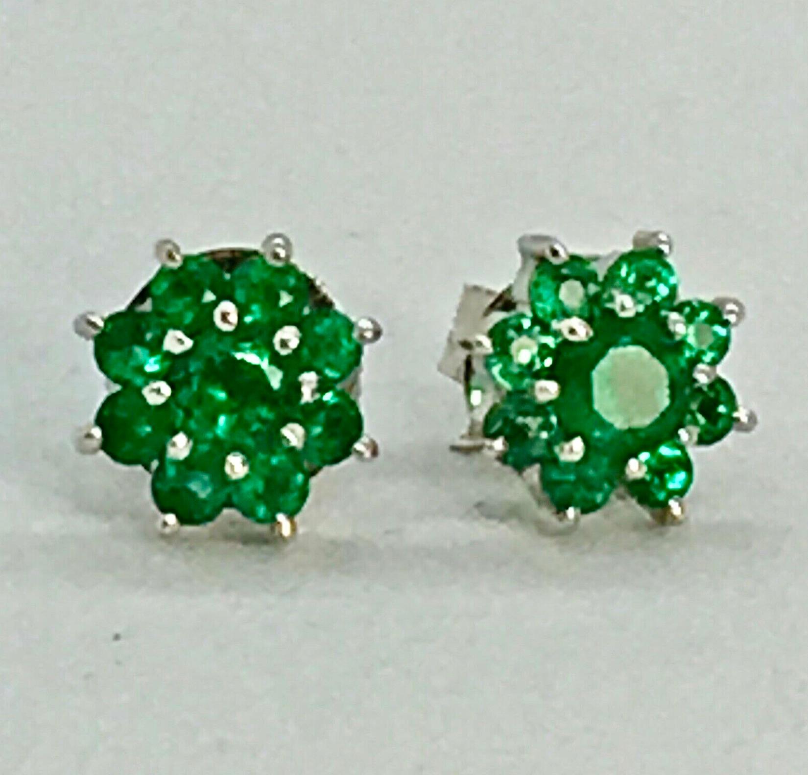 Elegantly flower cluster studs designed; each earring showcases 9 dazzling round cut natural Colombian green emeralds that securely sit in shared prongs in polished 18k white gold. A very versatile piece and easy to pair with any outfit.  
1.50