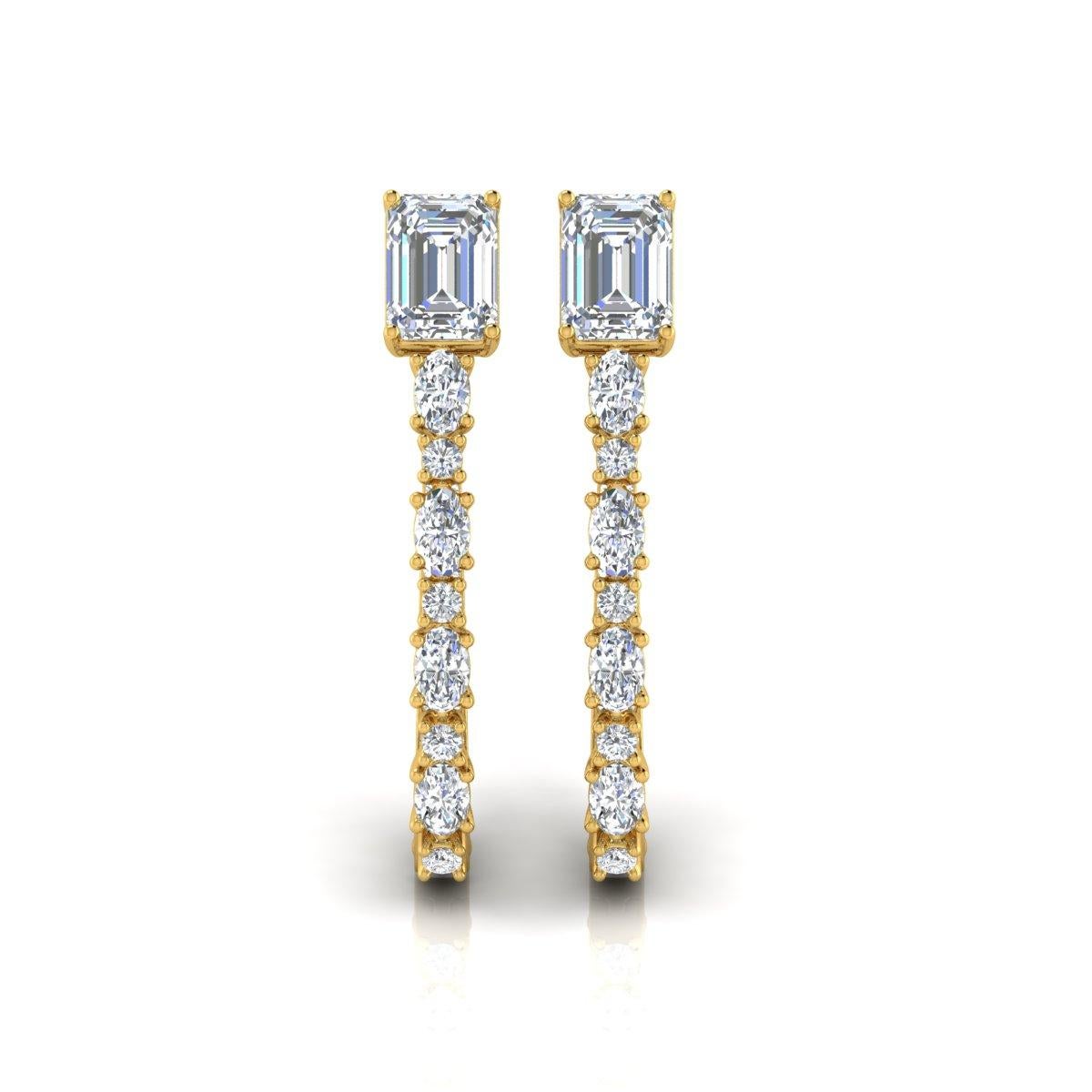 These stunning hoop earrings feature a total of 3.8 carats of natural diamonds, meticulously cut in a combination of round and emerald shapes for a striking visual appeal. Crafted in 18 karat yellow gold with a total weight of 6.06 grams, these