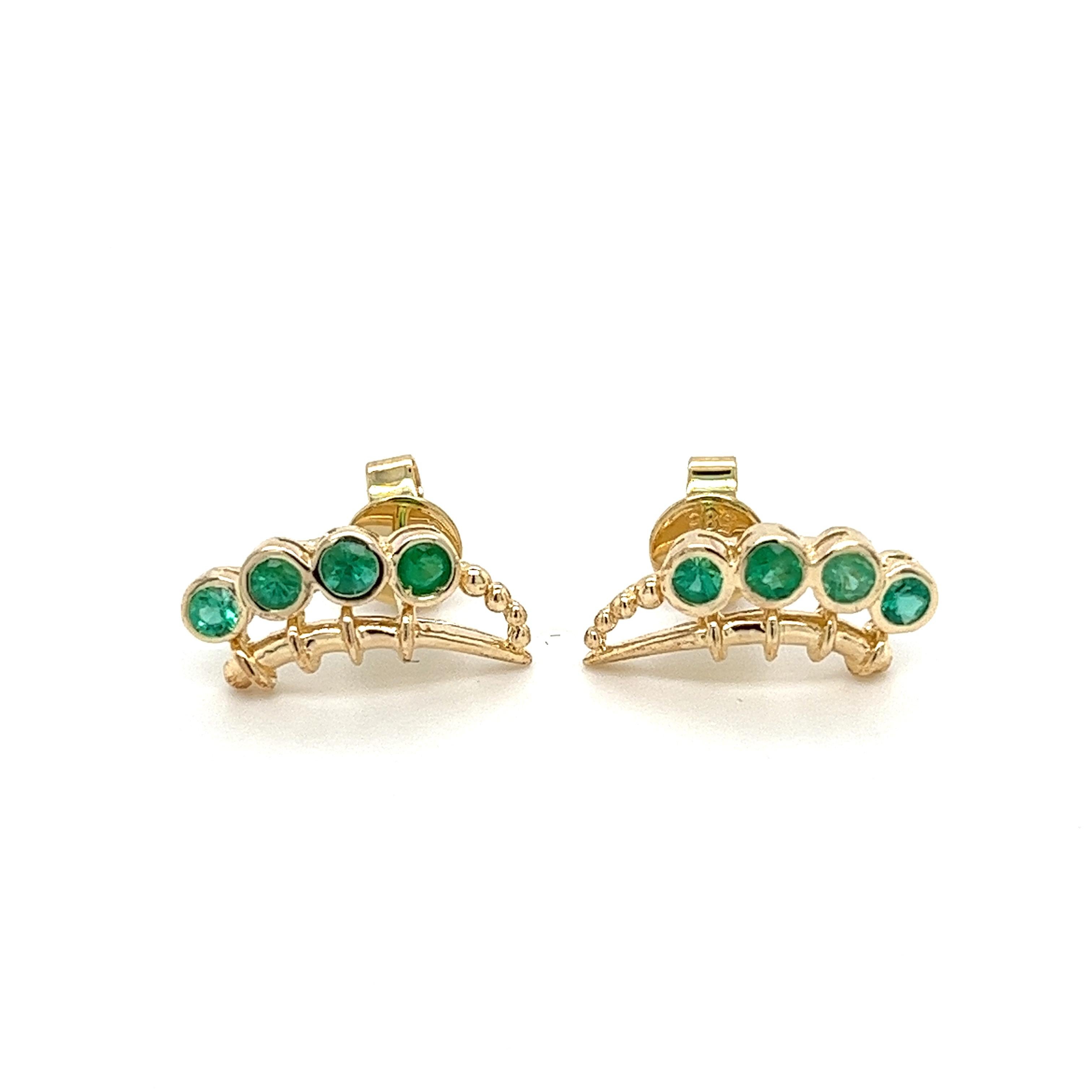 14K solid yellow gold ear climber stud earrings set with 8 natural round cut emeralds. A gorgeous display of contrast and grace. Aesthetically versatile enough for cartilage and earlobe placement.

FEATURES: Earring box + travel pouch, and a