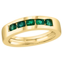 Fede nuziale con smeraldo rotondo e cinque pietre incastonate a canale/anello in oro giallo 18 Kt Unisex