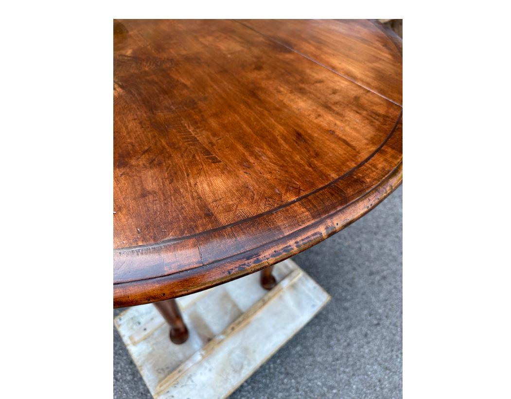 This is a beautiful custom made dining table from England! The wood has lovely natural detail and is a gorgeous warm tone. Very simple, yet elegant design with round top and pedestal base. This table would make an excellent addition to your dining