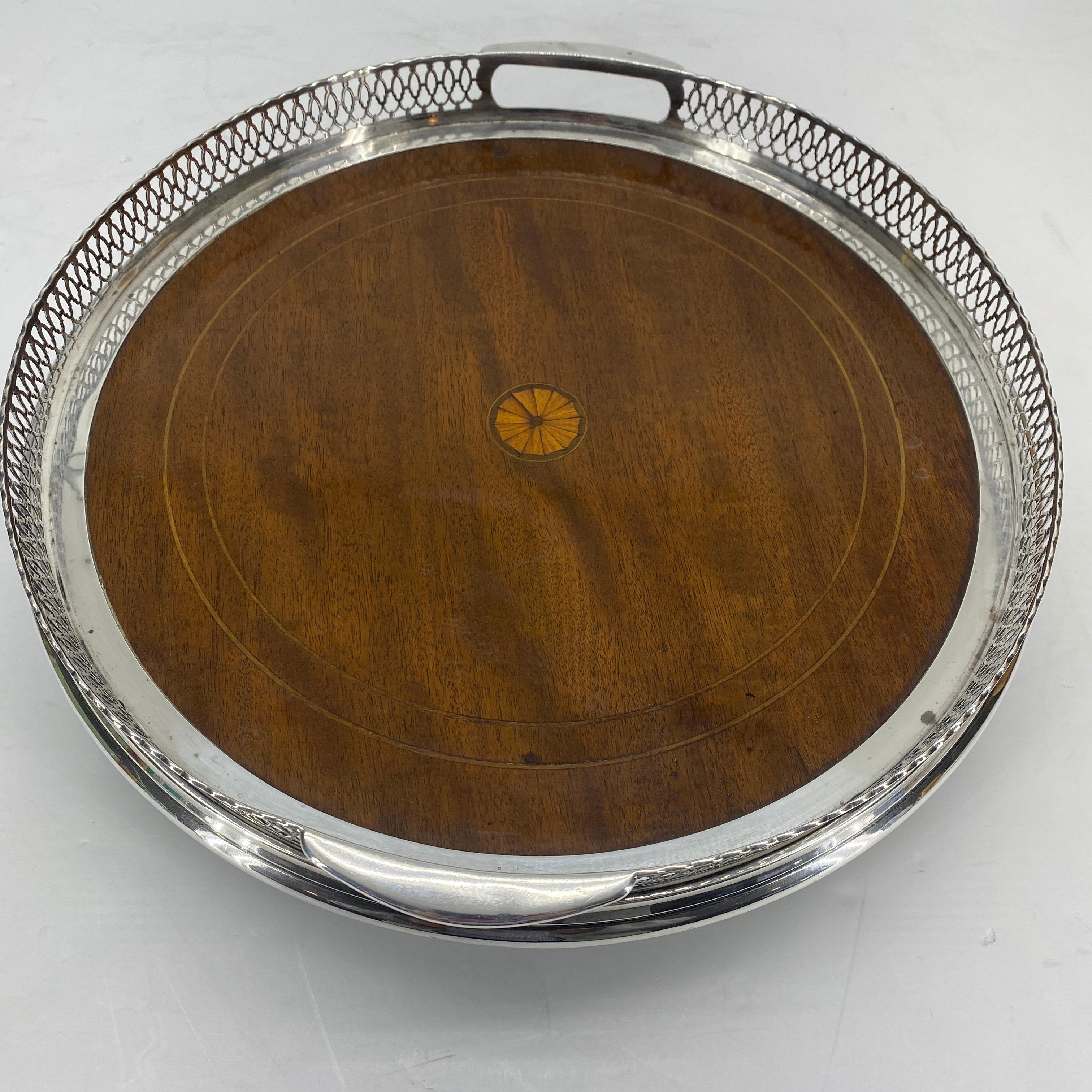 Small Victorian style silver gallery tray with marquetry base and pierced border.

 