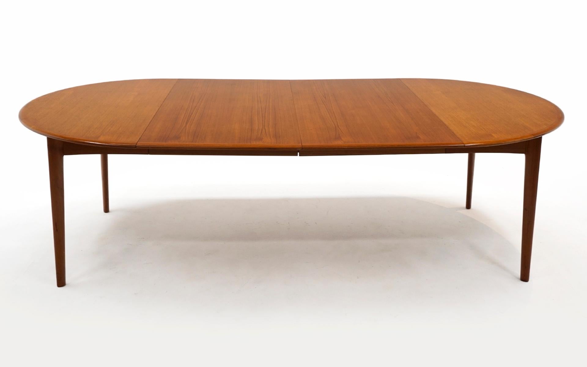 Danish Modern 48 inch round teak dining table with two extension leaves. Very good original condition. Some light scratches as can be seen in our photos. We acquired this table from the original owners that bought it new in Denmark in 1962. It has
